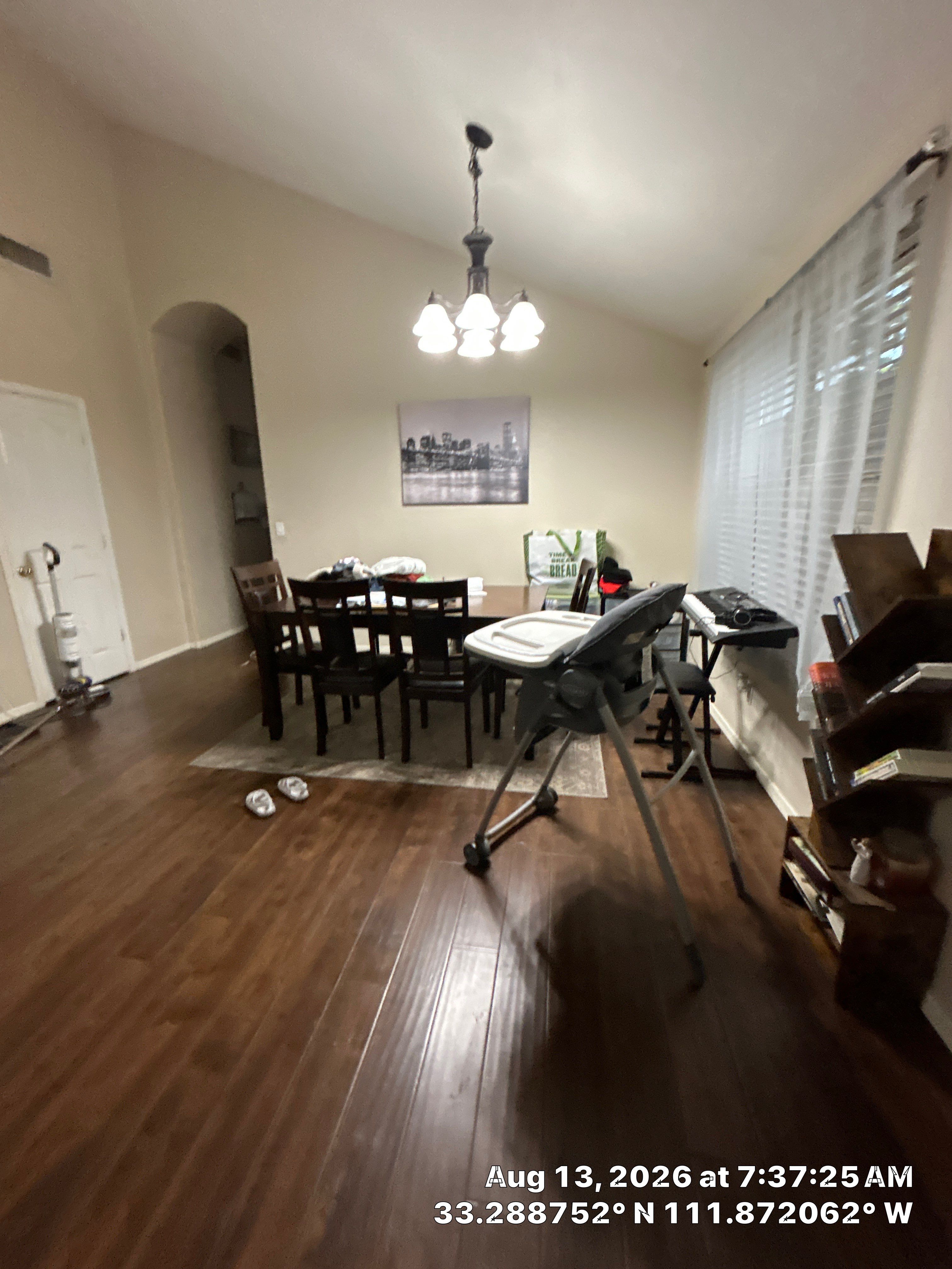 Dark Wood Laminate Flooring Installation in Chandler Dining Room by CompanyCam Sales Demo