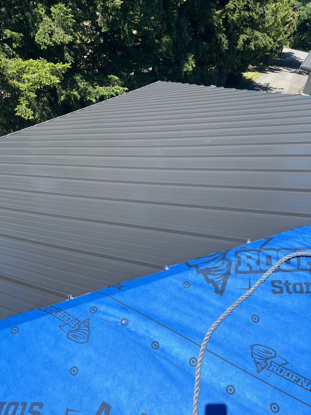 Residential Roofing Installation using 12" Prolok metal  by Top Notch Roofing Inc