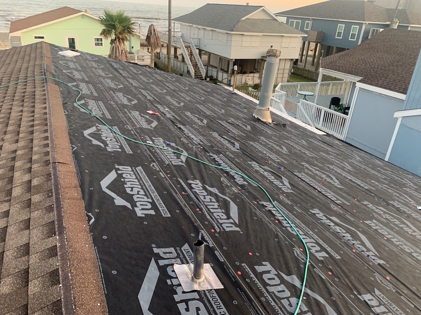 Galveston Waterfront Roof Installation In Progress by Elite Roofing LLC