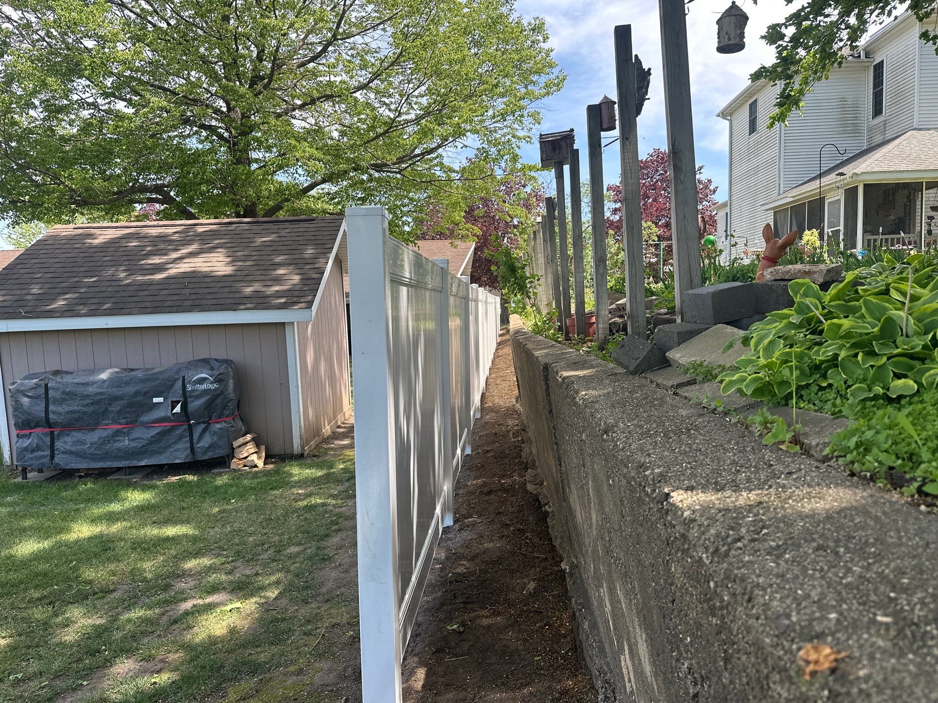 White Vinyl Privacy Fence Installation in Lawler, IA by Perfect Picket Fence and Stain