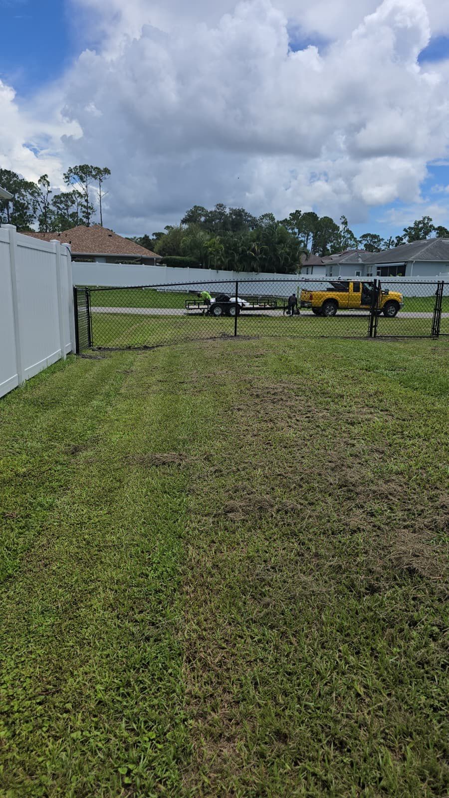 Black Chain Link Perimeter Fencing for North Port Residential Property by True Fence LLC