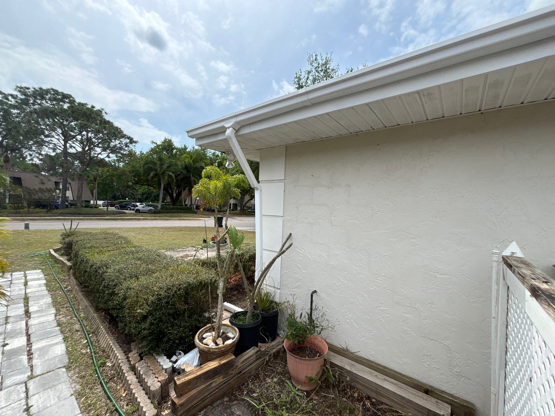 Gutter Project with White 6-K Seamless Gutters Installation and Downspouts in Sarasota FL by Gutter Professors