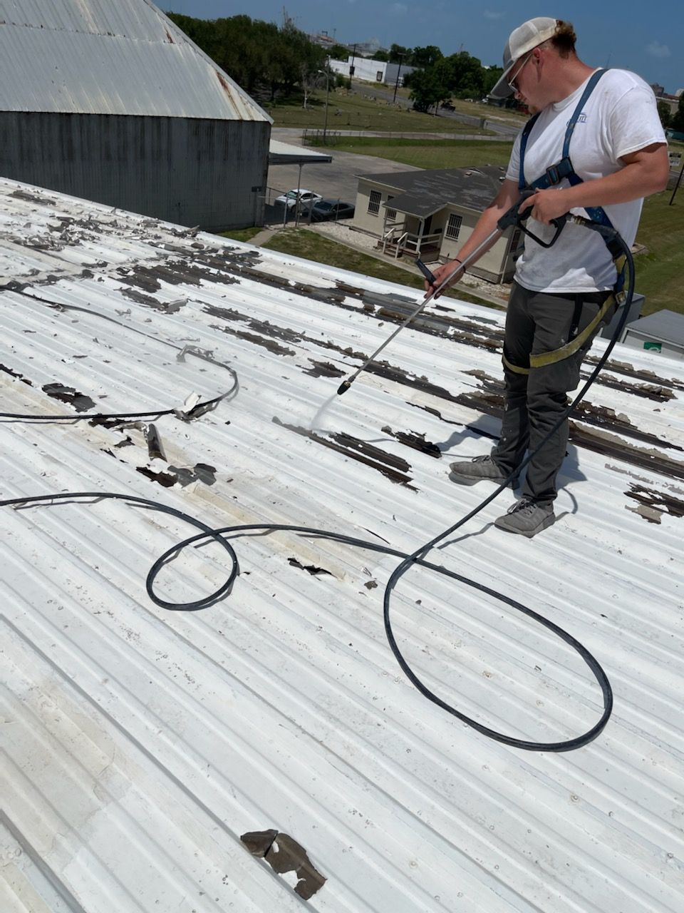 Commercial Roofing Installation using GAF 10 Year Acrylic System by Lighthouse Roofing