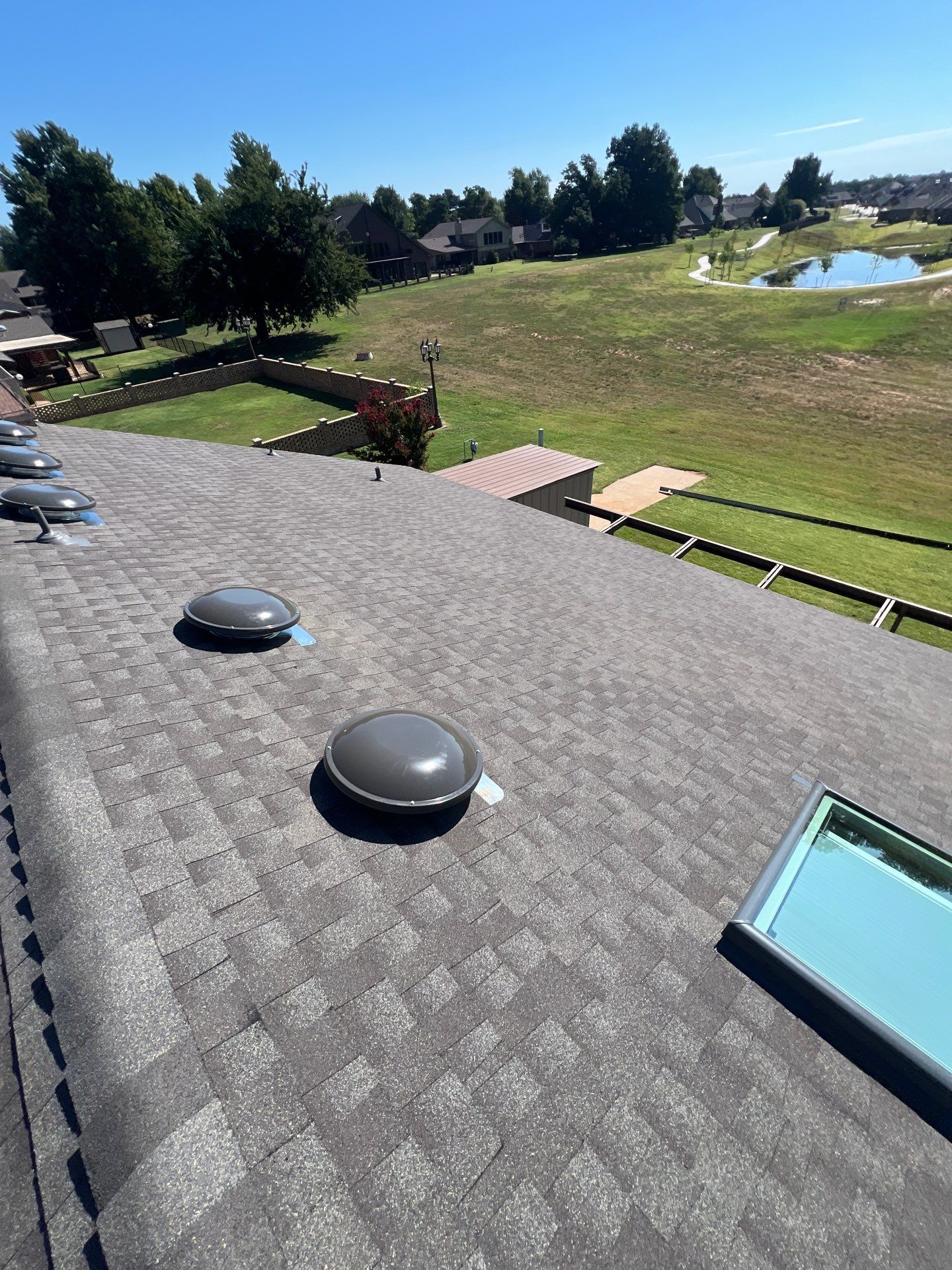 Roof Replacement and Skylight Replacement in Yukon by McCann's Roofing and Construction