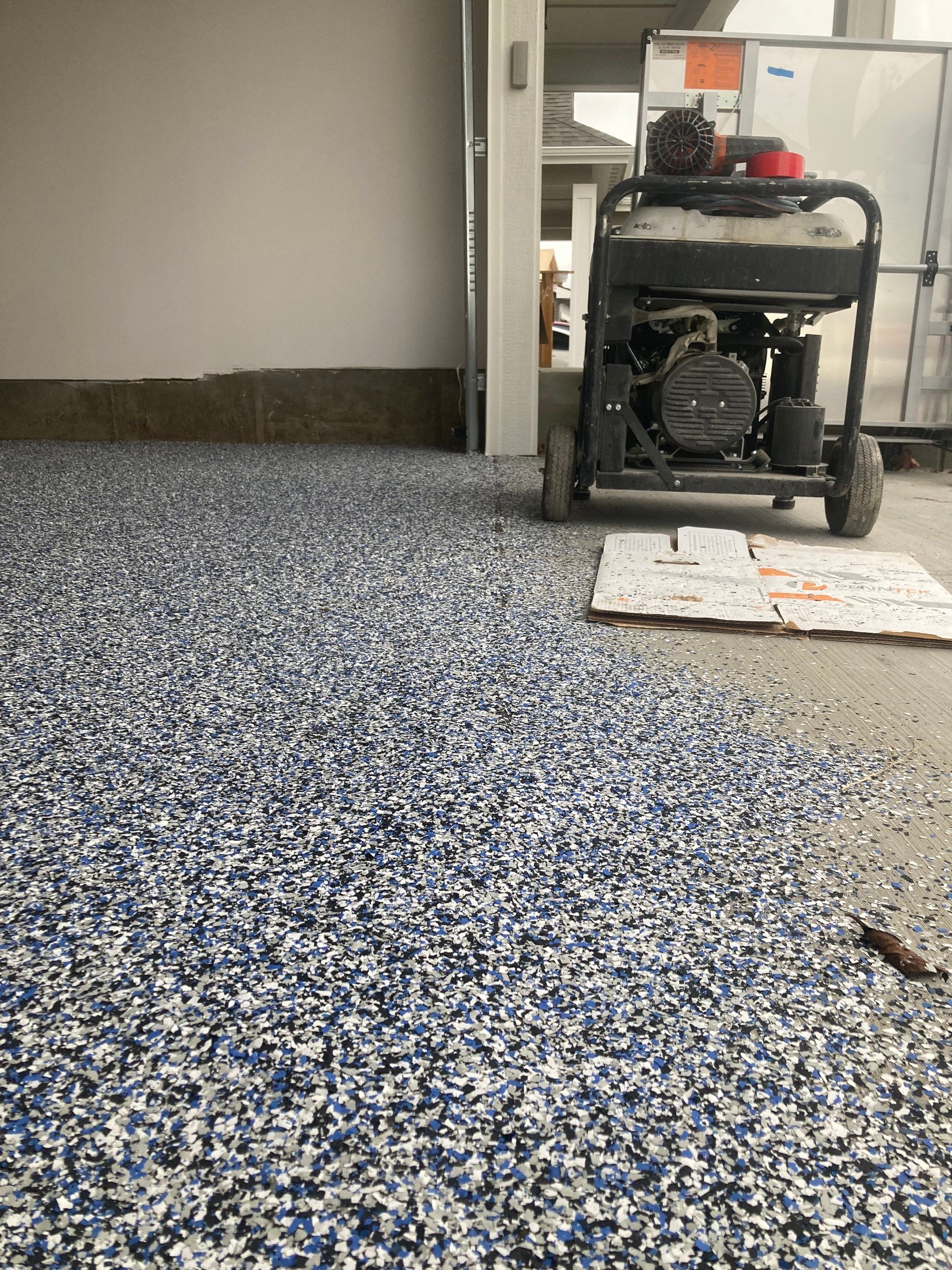 Garage Transformation using Domino with Blue by Croc Coatings, LLC