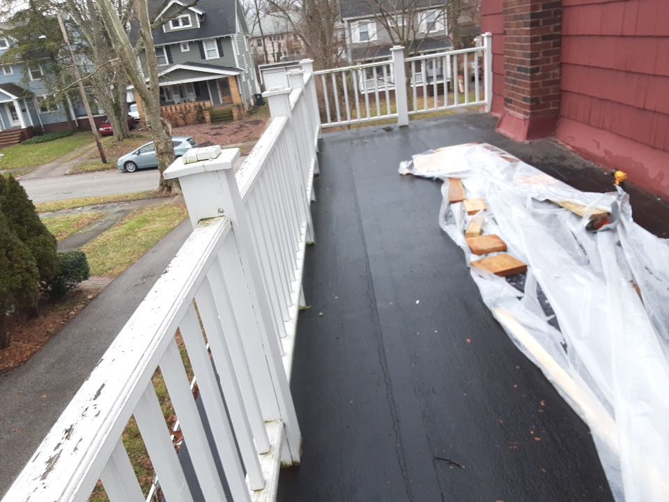 Residential Roof Replacement using Patio Roof by Absolute Roofing and Construction