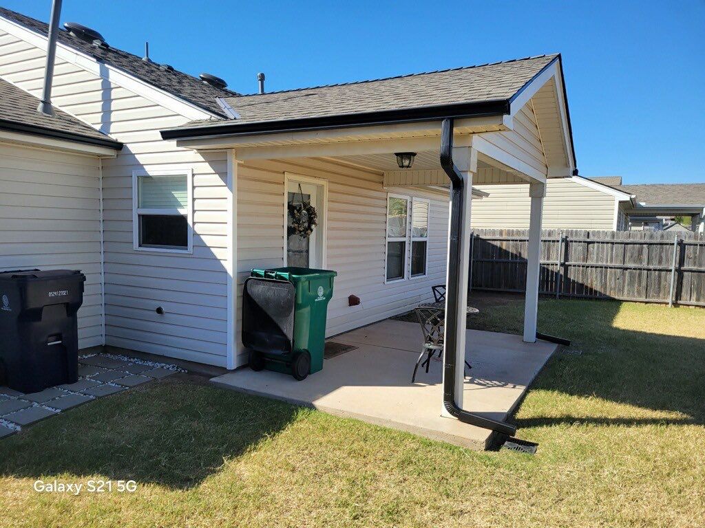 Roof Replacement and Gutter Installation in Edmond, OK by McCann's Roofing and Construction