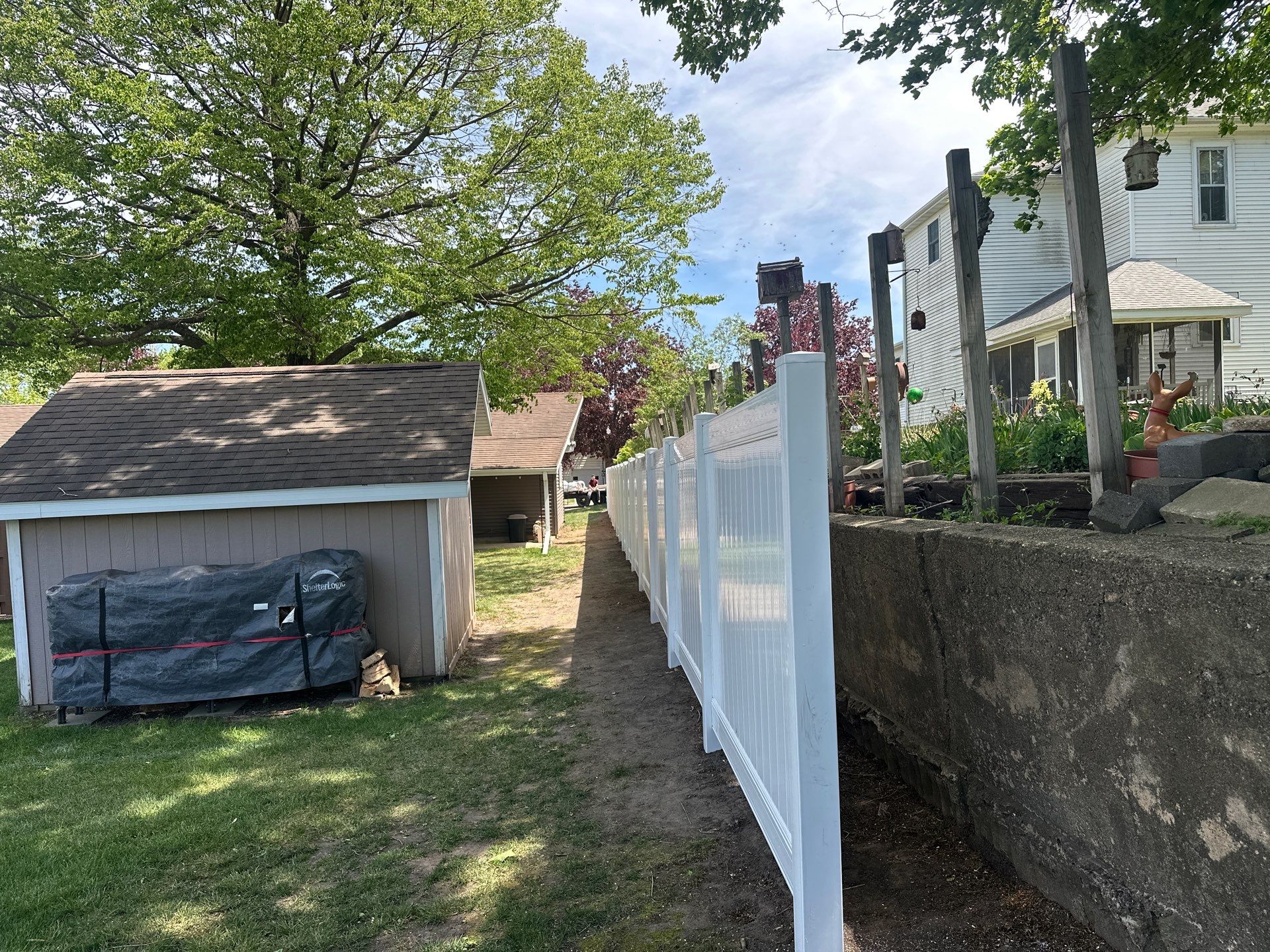 White Vinyl Privacy Fence Installation in Lawler, IA by Perfect Picket Fence and Stain