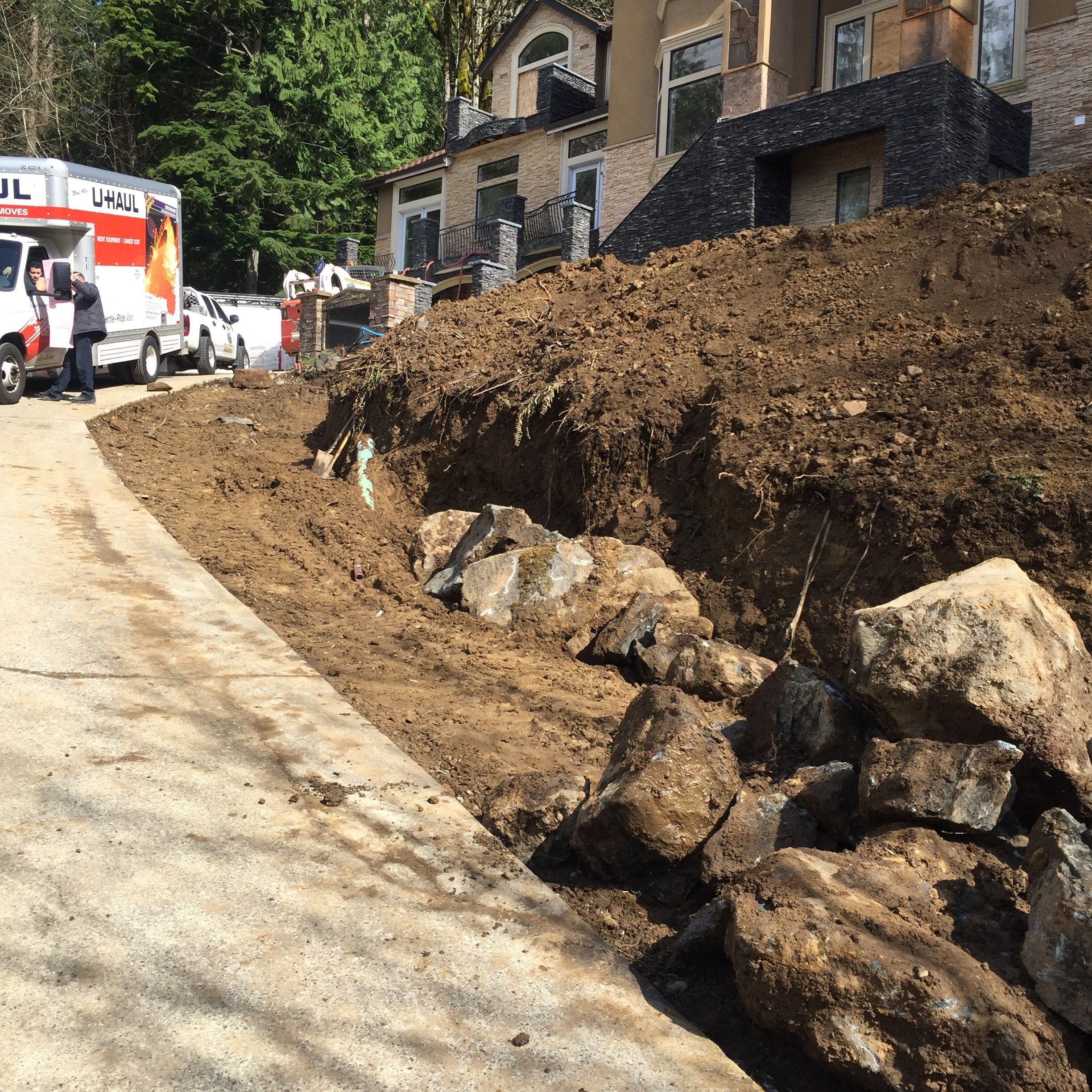 Asphalt Driveway and Stamped Concrete Patio Finish  by Jireh Asphalt & Concrete Inc 