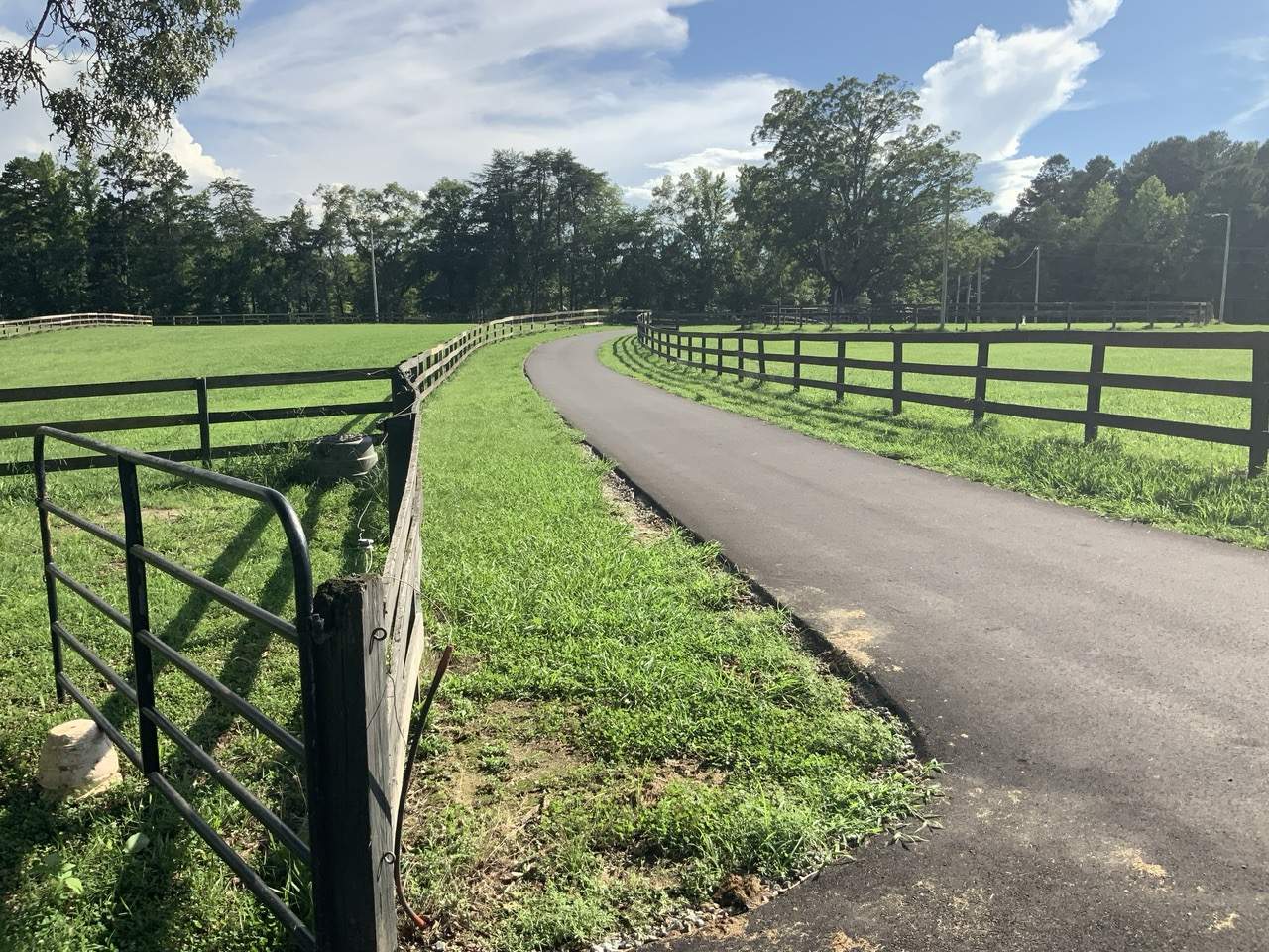 Fence Staining (Farm in Durham NC) by GonzalezPainters & Contractors Inc 