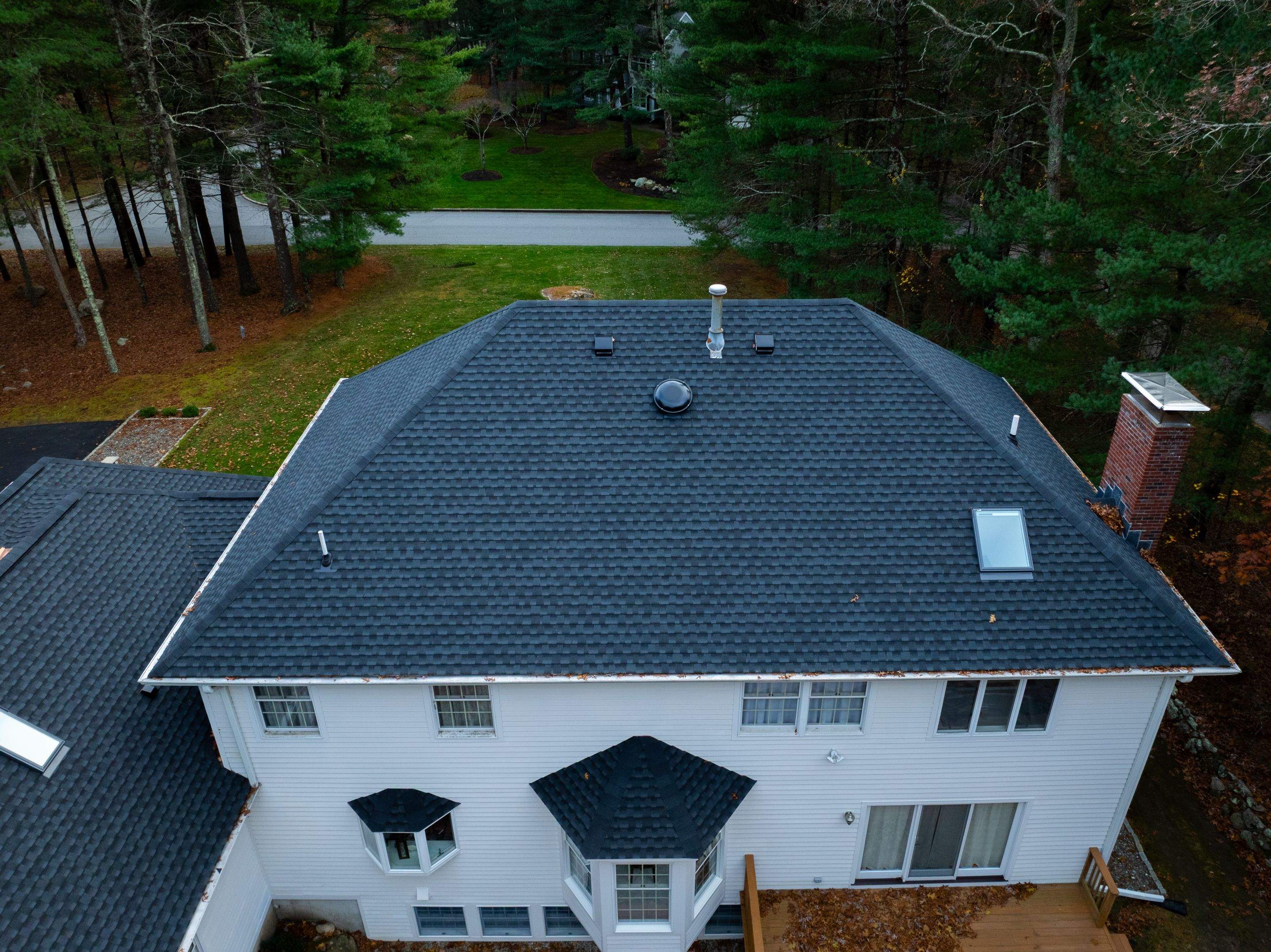 High Hawk - Architectural Shingles, Copper Brick Flashing, Skylights by Rinaldi Brothers