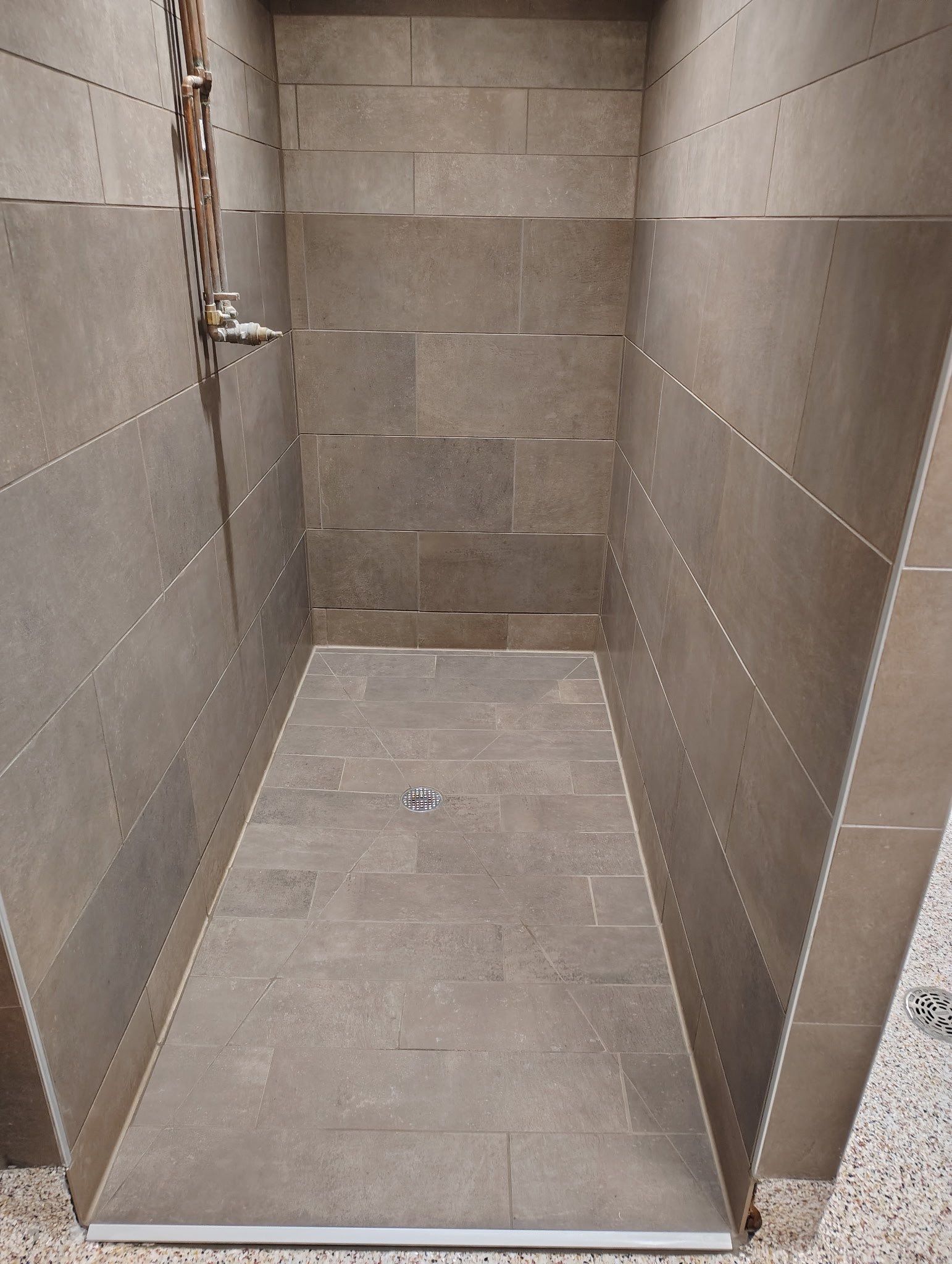 Trucking company showers by Footprints Floors of Nashville