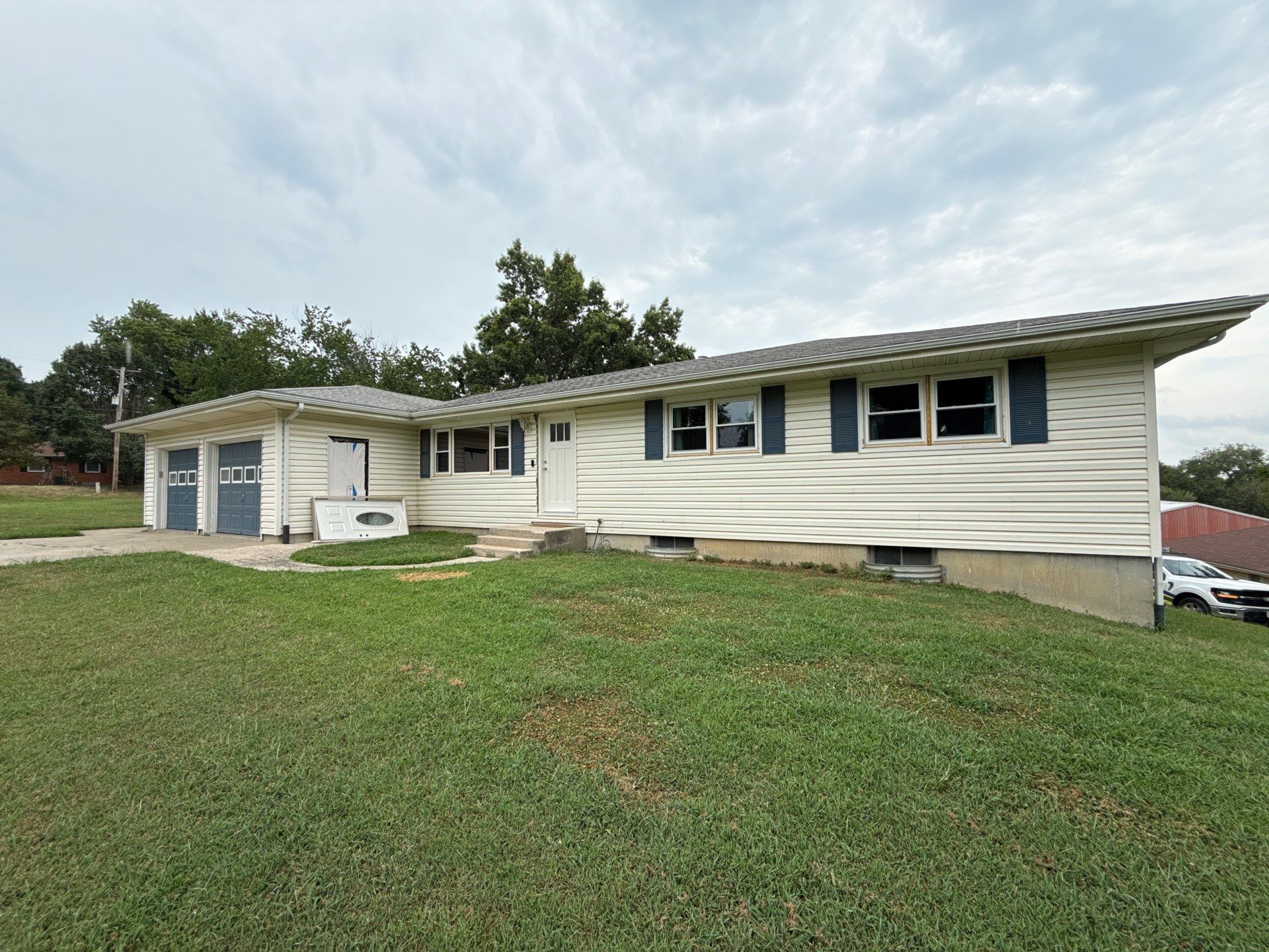 Indigo Board and Batten Siding and Window Replacement in Smithville by EEC Windows, Siding & Roofing