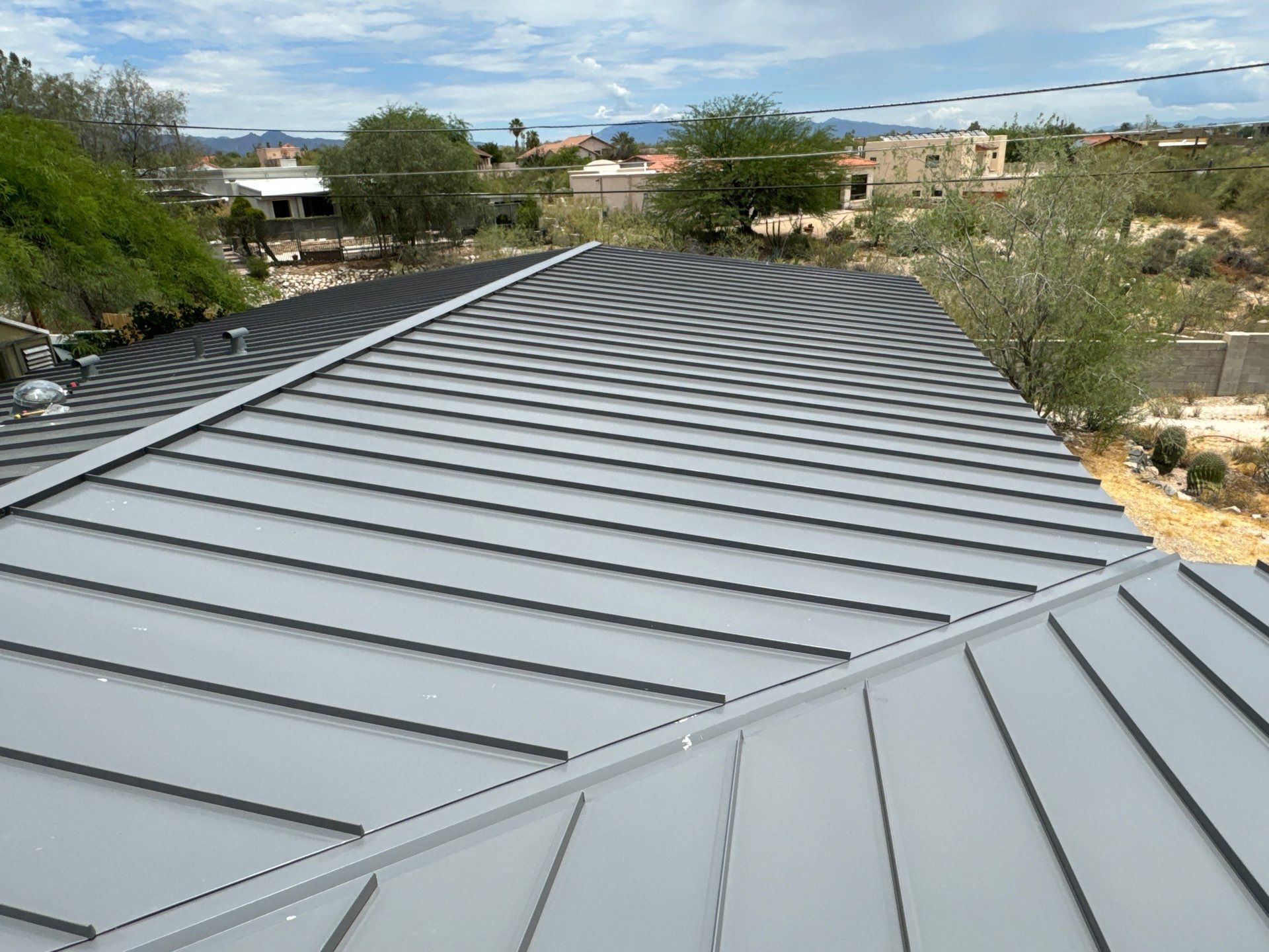 Charcoal Gray Standing Seam by Reimagine Roofing