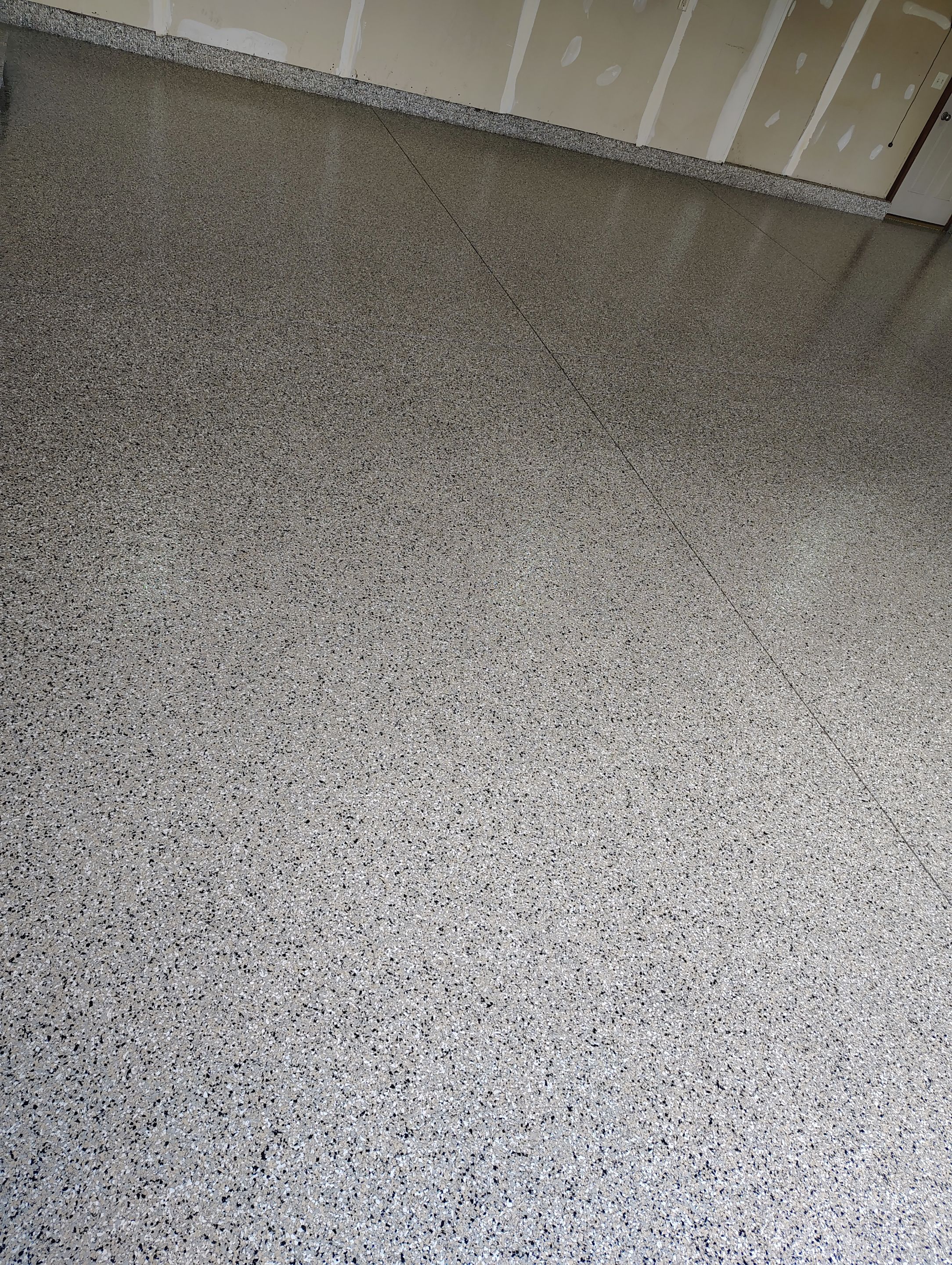 Multi-Car Garage Concrete Coating and Epoxy Finish in Sioux Falls by Select Painting, Coatings & Garage Cabinets