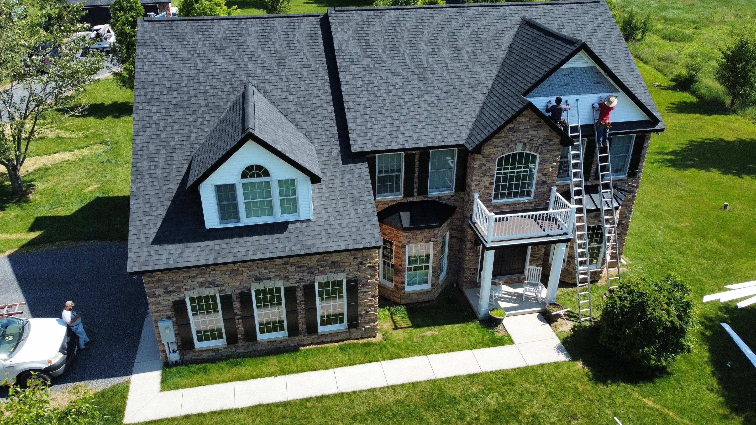 Roof Damage using Certainteed Lifetime Roofing System- Moire Black Landmark Pro shingkes with shadow ridge caps. by BulletpROOF Exteriors