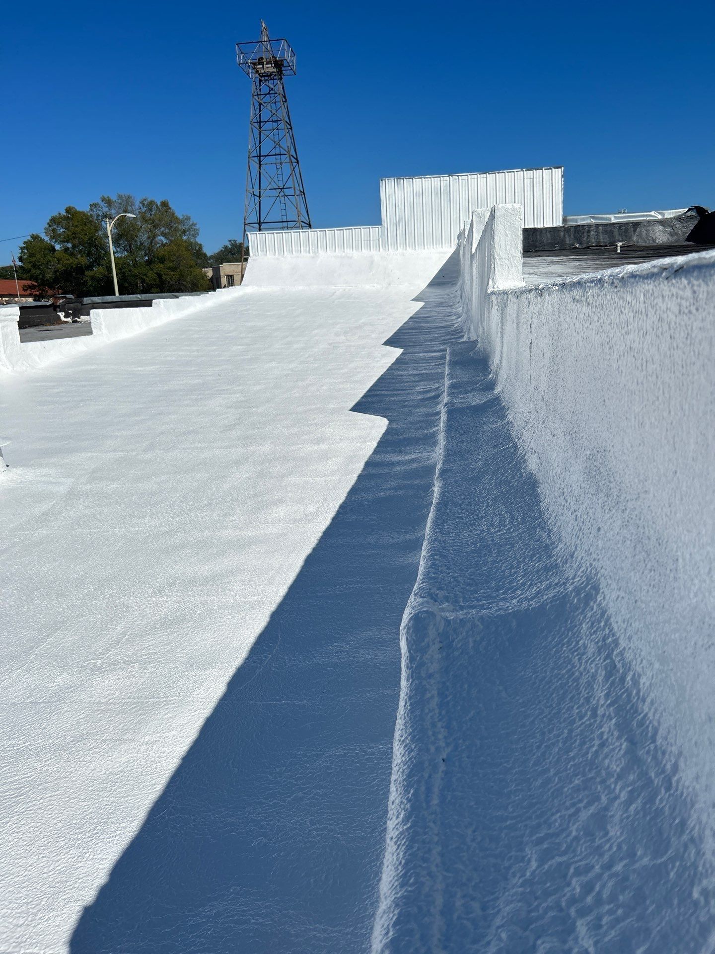 Downtown Gladewater Commercial Foam Roof Restoration – SPF + High-Tensile Acrylic by All Star Roofing LLC