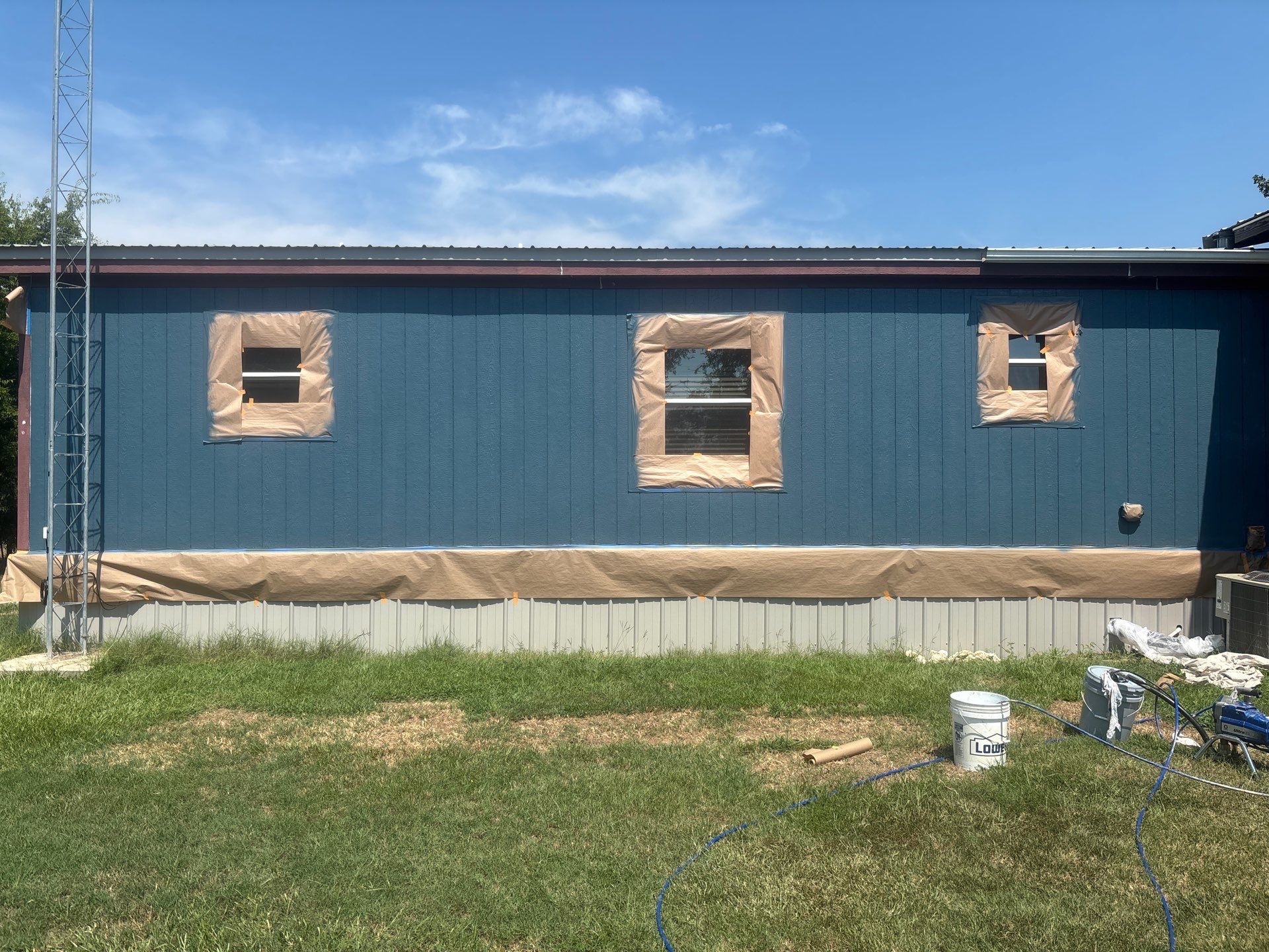 Exterior Painting in Fruitvale, TX | Wood Porch & Home in Deep Navy Blue by Quality Coats Painting