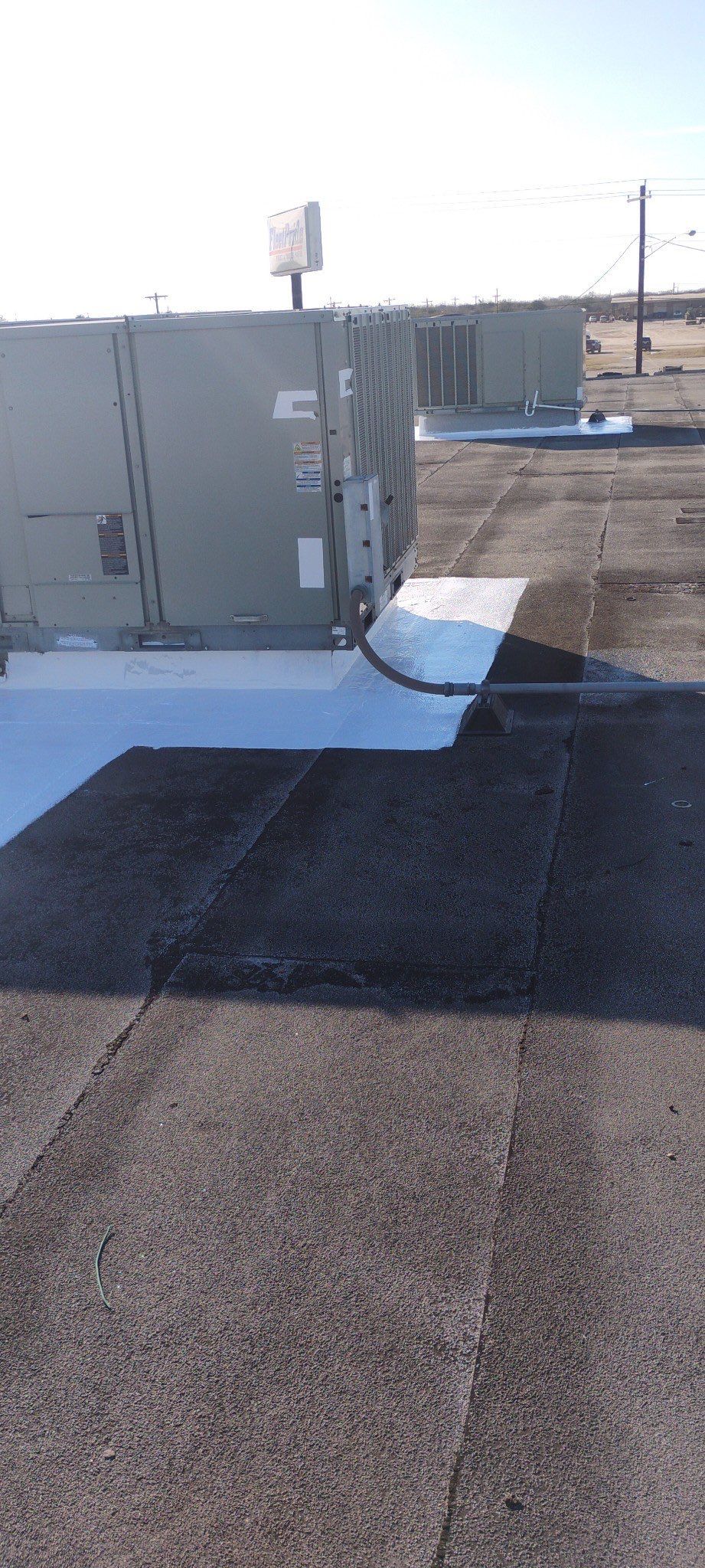 Commercial Silcone Roof Repair using Silcone Coating by Galvan Roofing and Construction