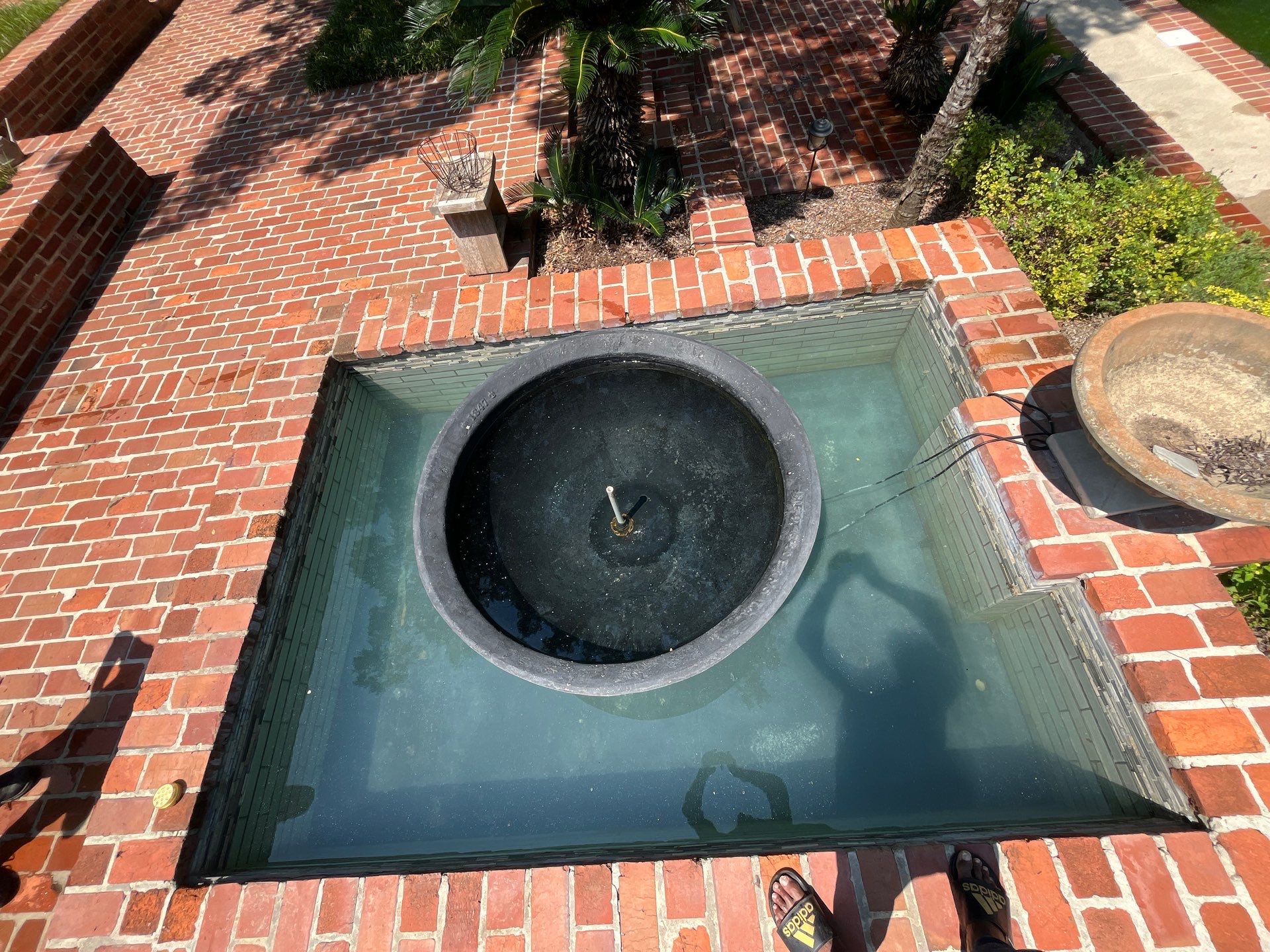Pool Cleaning using Pool Cleaner by College Bros Outdoor services