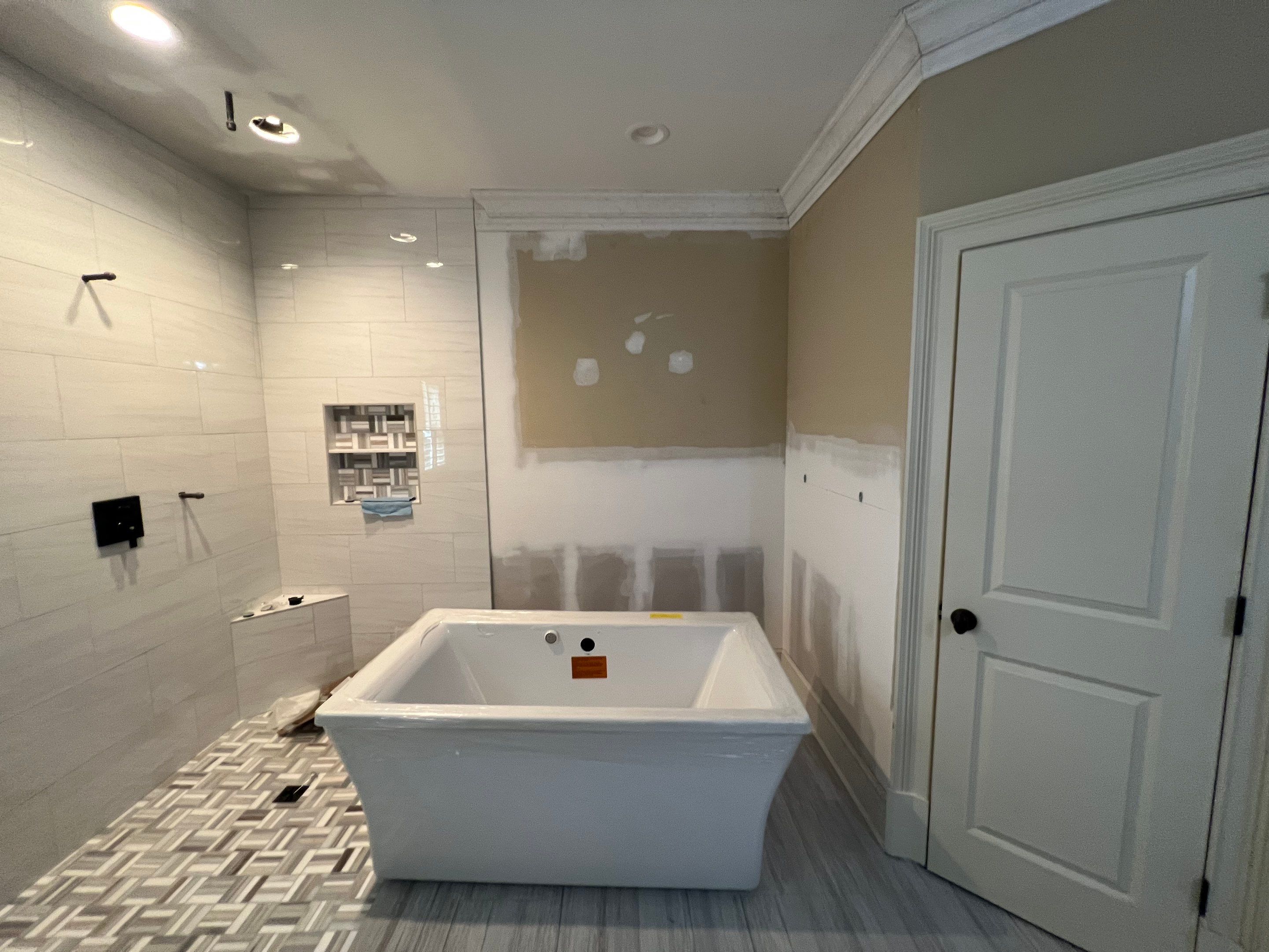 Modern Master Bathroom Renovation With Freestanding Tub in Smyrna by Swift Home Renovations 