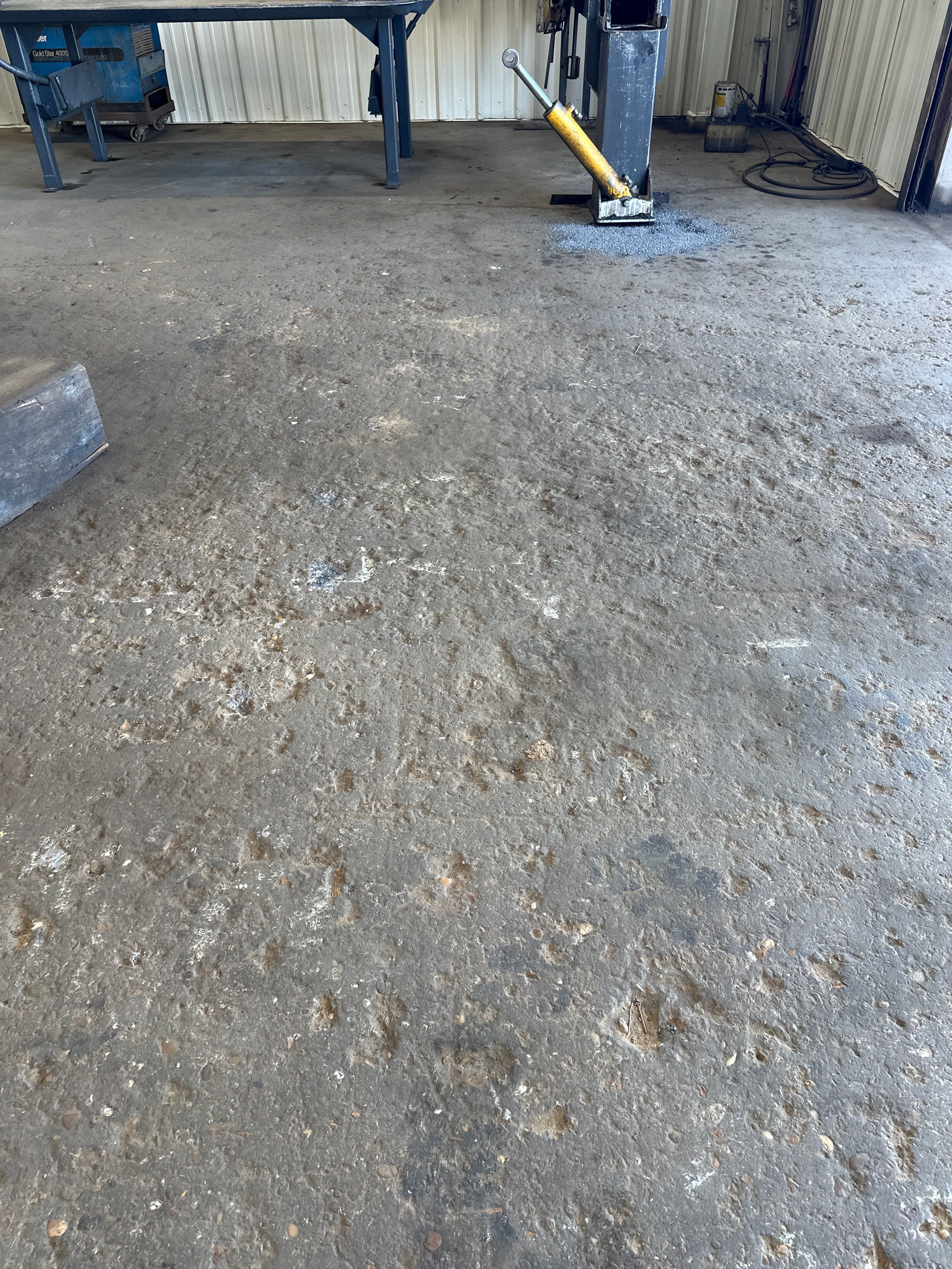 Industrial Epoxy Flooring for Heavy Equipment Work Bay in Mobile by Cornerstone Hard Surface Restoration