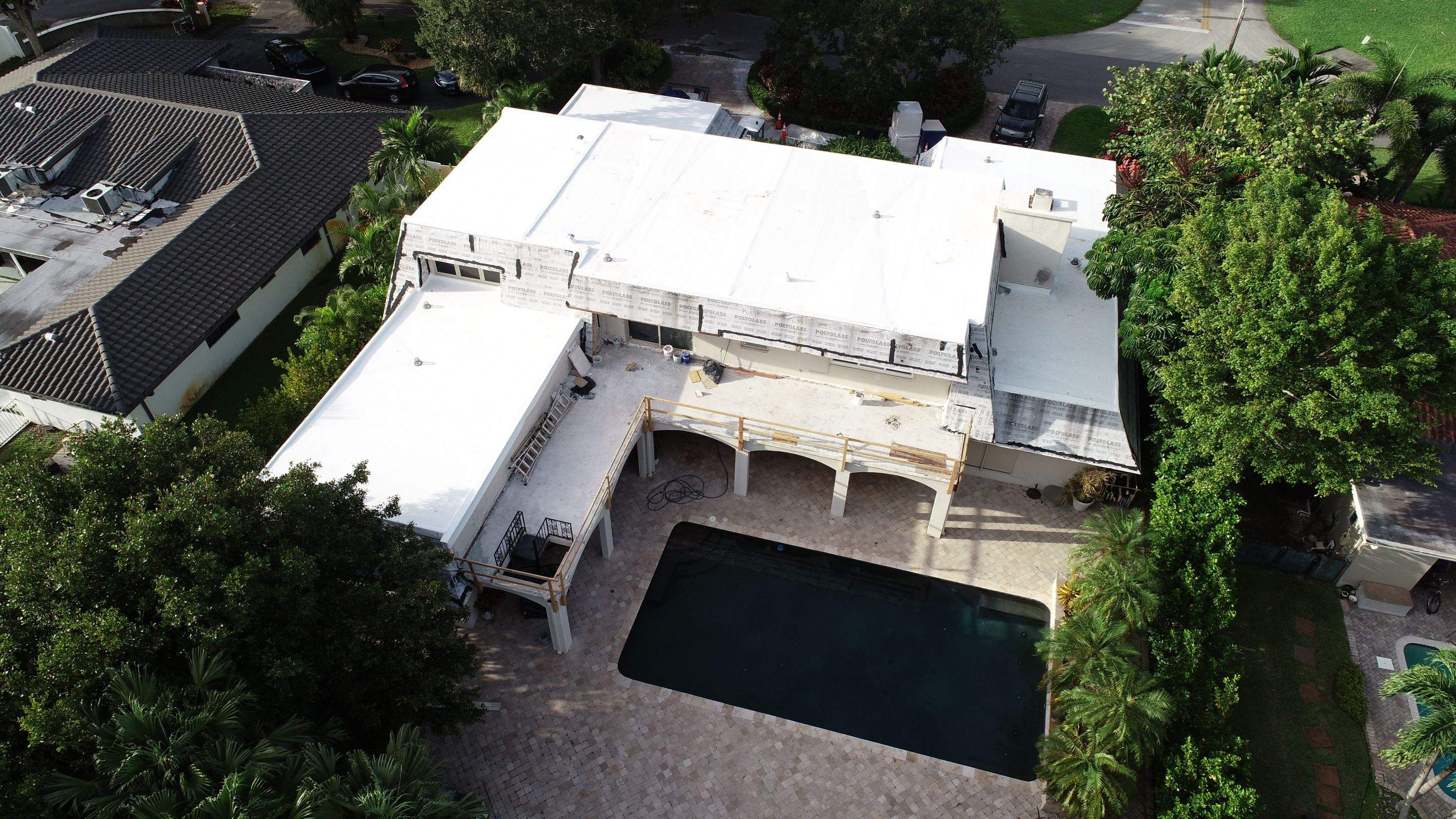 Amazing TPO flat deck re-roof with Eagle mansard in Hollywood Florida.  by First Due Roofing