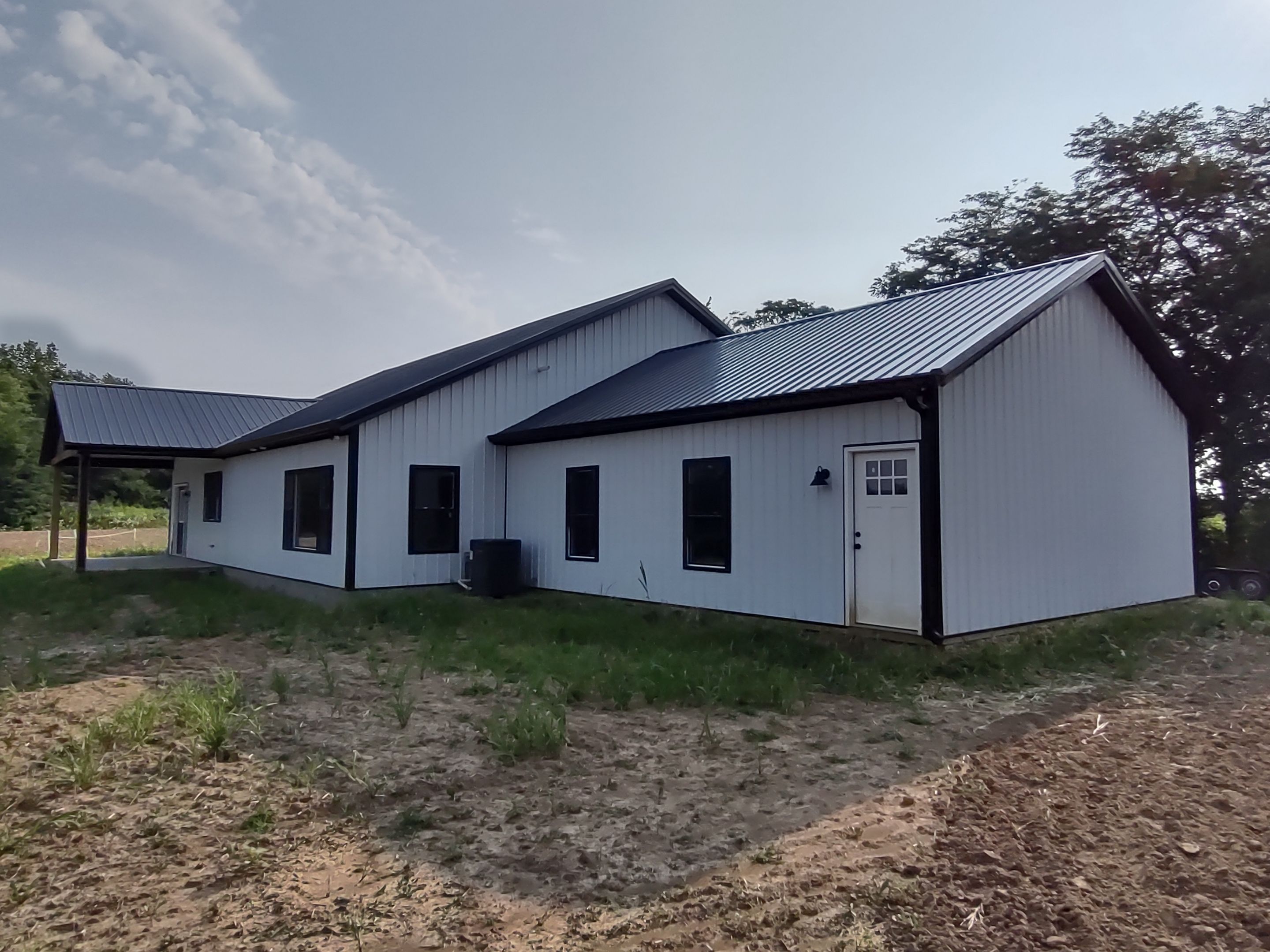 Pole Barn Home  by The Barn Builders 