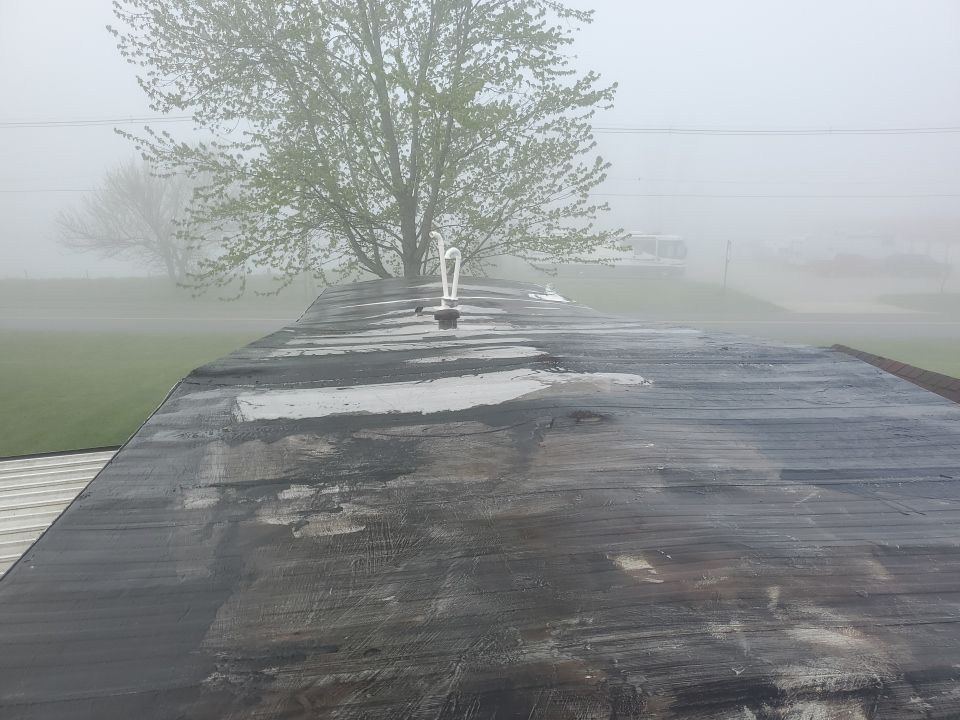 Residential Roofing Installation using 60 mil rubber roof  by Nitro Roofing and Construction