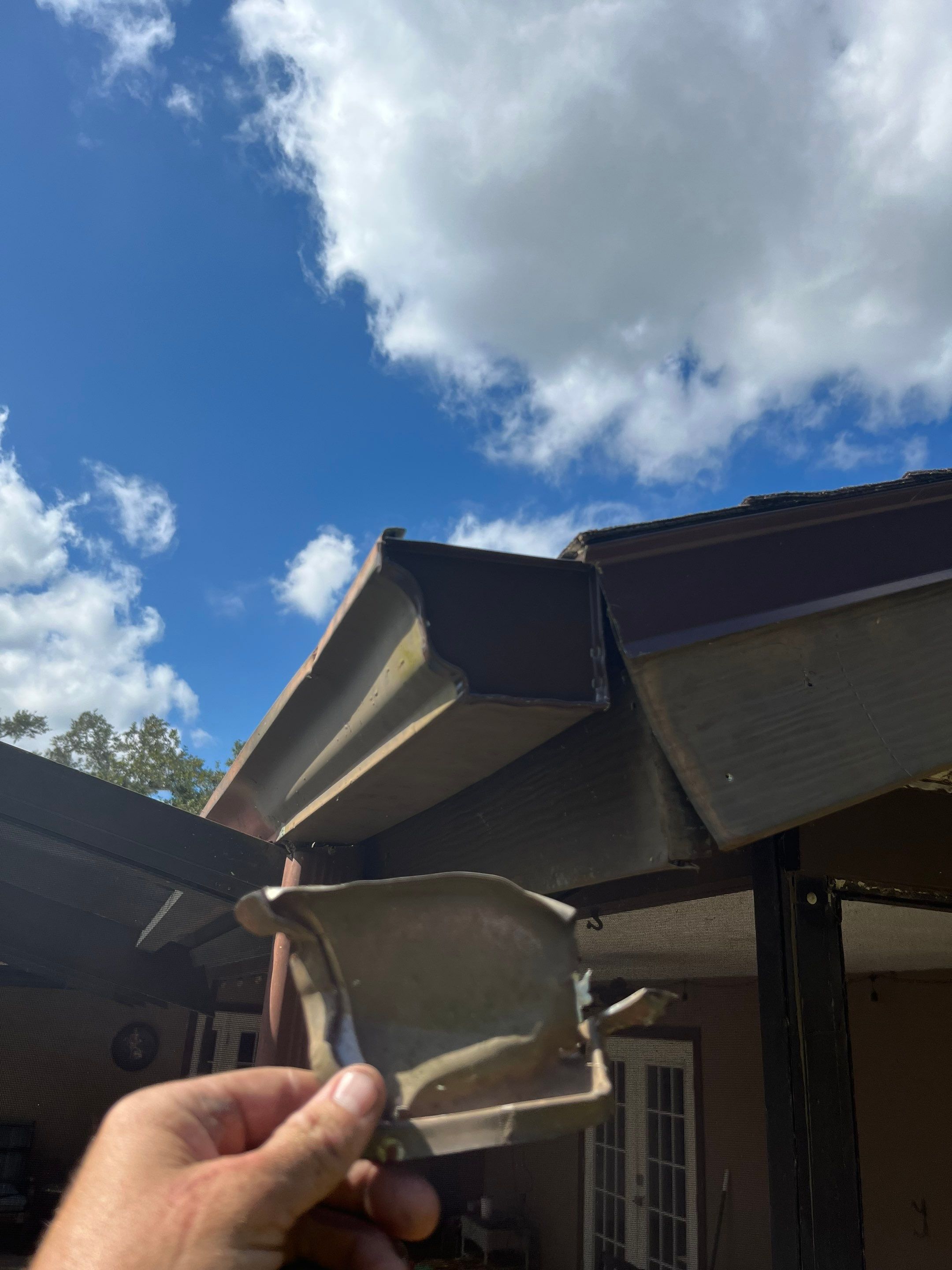 Brown Seamless Gutters for Beach Cottages in Sarasota FL by Gutter Professors