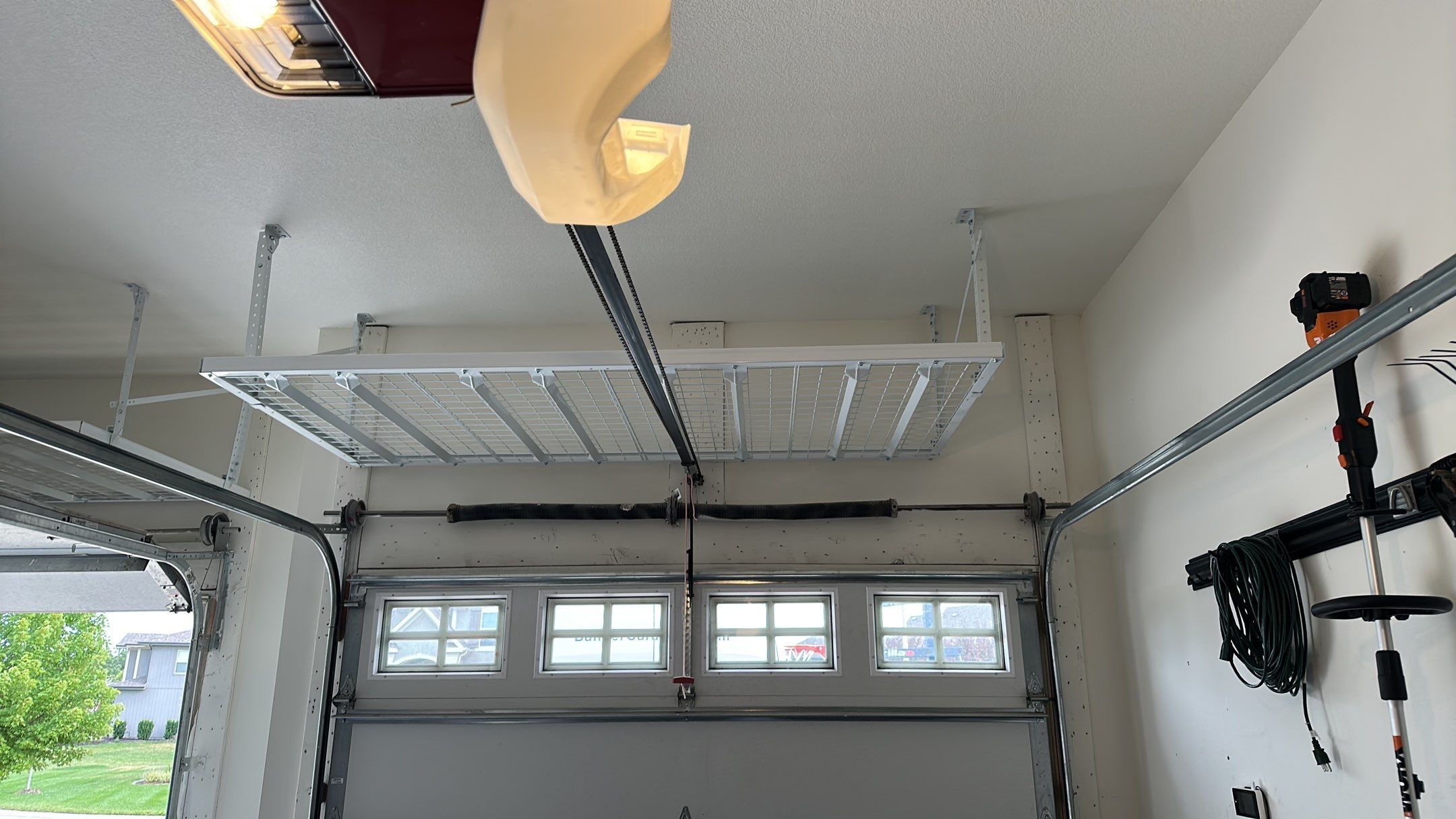 Garret M. upgraded his garage with overhead racks  by Banner Garage