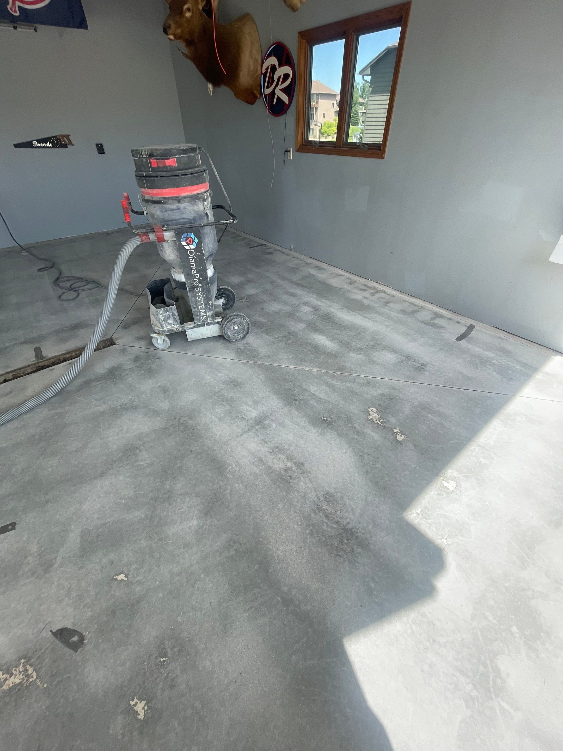 Full Garage Floor Epoxy Coating Installation in Dell Rapids by Select Painting, Coatings & Garage Cabinets