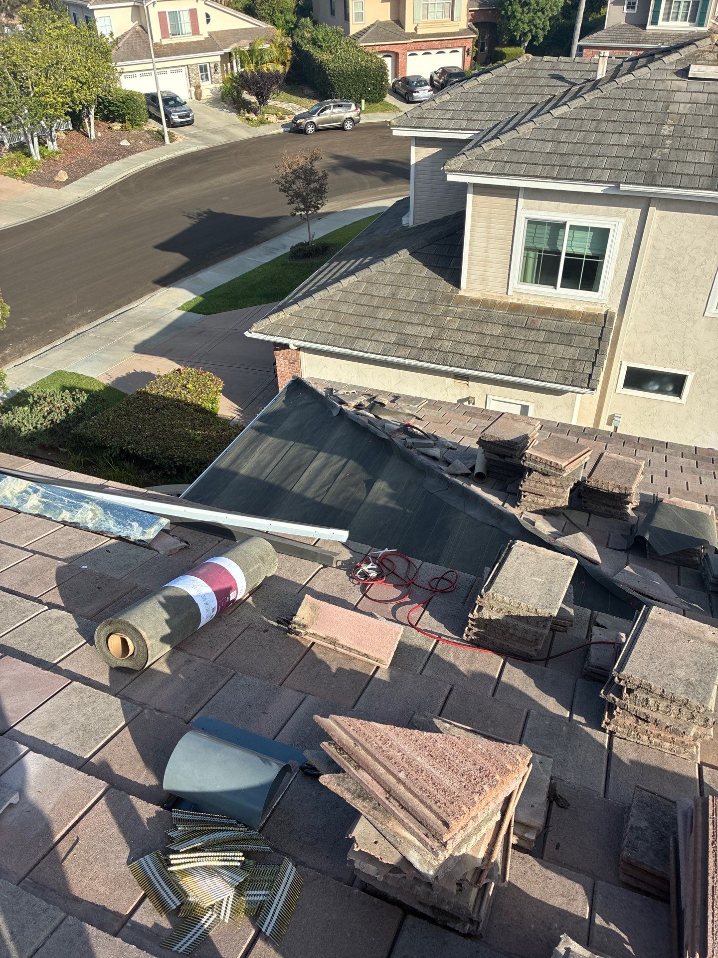 Carlsbad Concrete Tile Roof Replacement with Copper Flashing and Skylights by Reliable Roofing San Diego Inc.