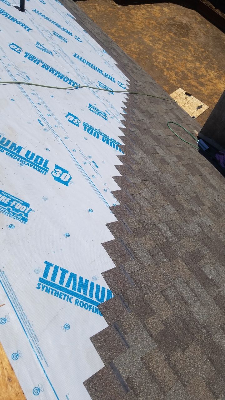 New Roof and Gutters adds value to this home by Byers Enterprises 