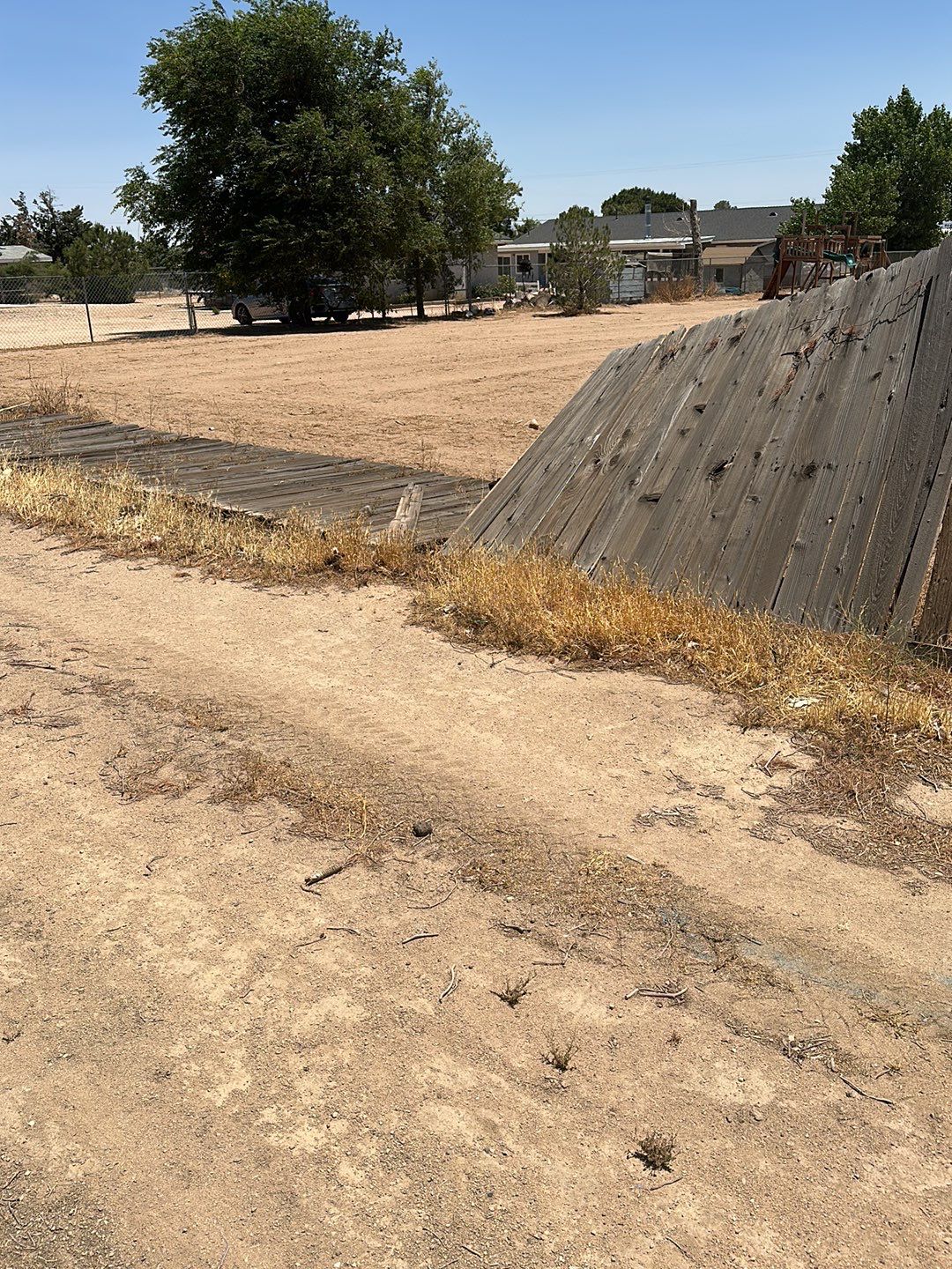Replaced wood fence with chain link fence.  by Fence Guys Inc. 
