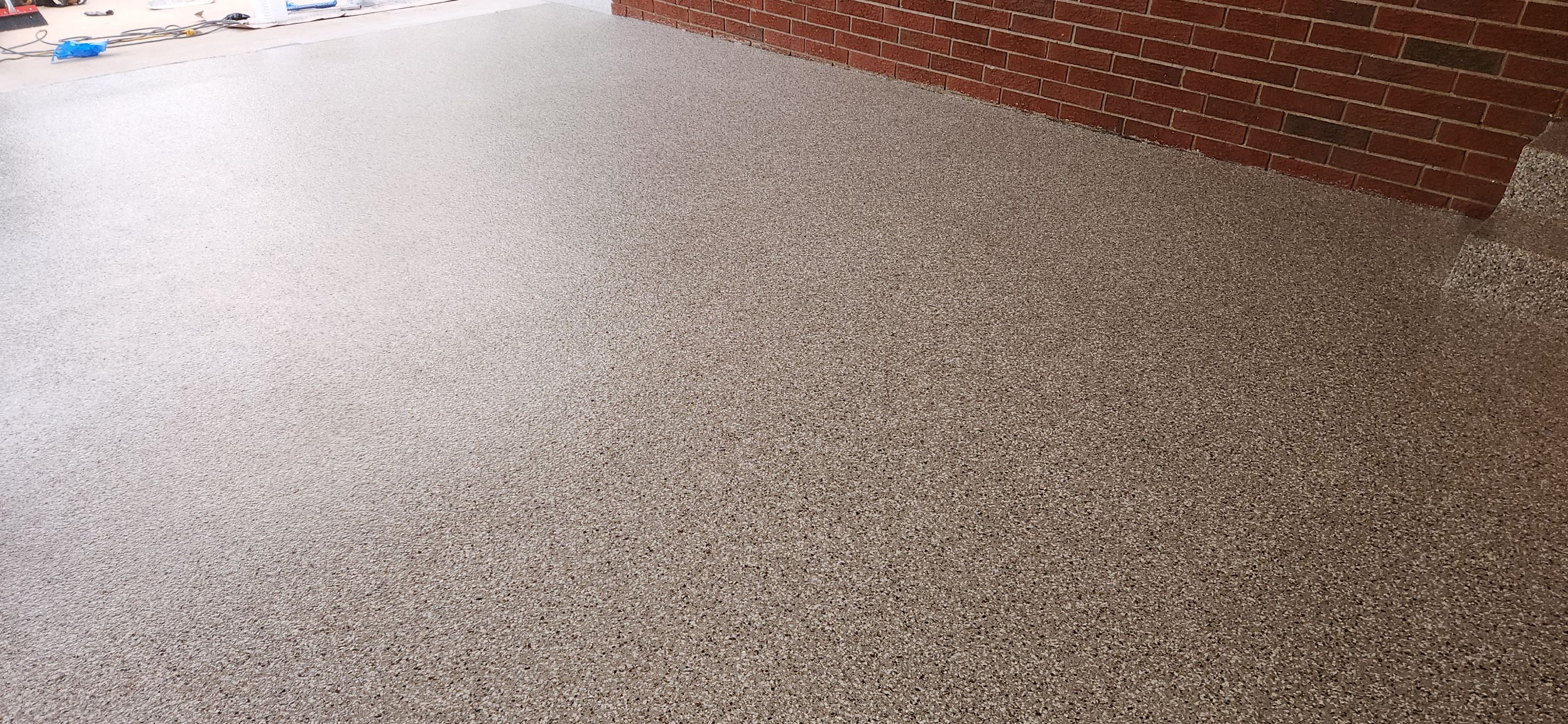 Back Patio using Creekbed by Elite Floor Solutions