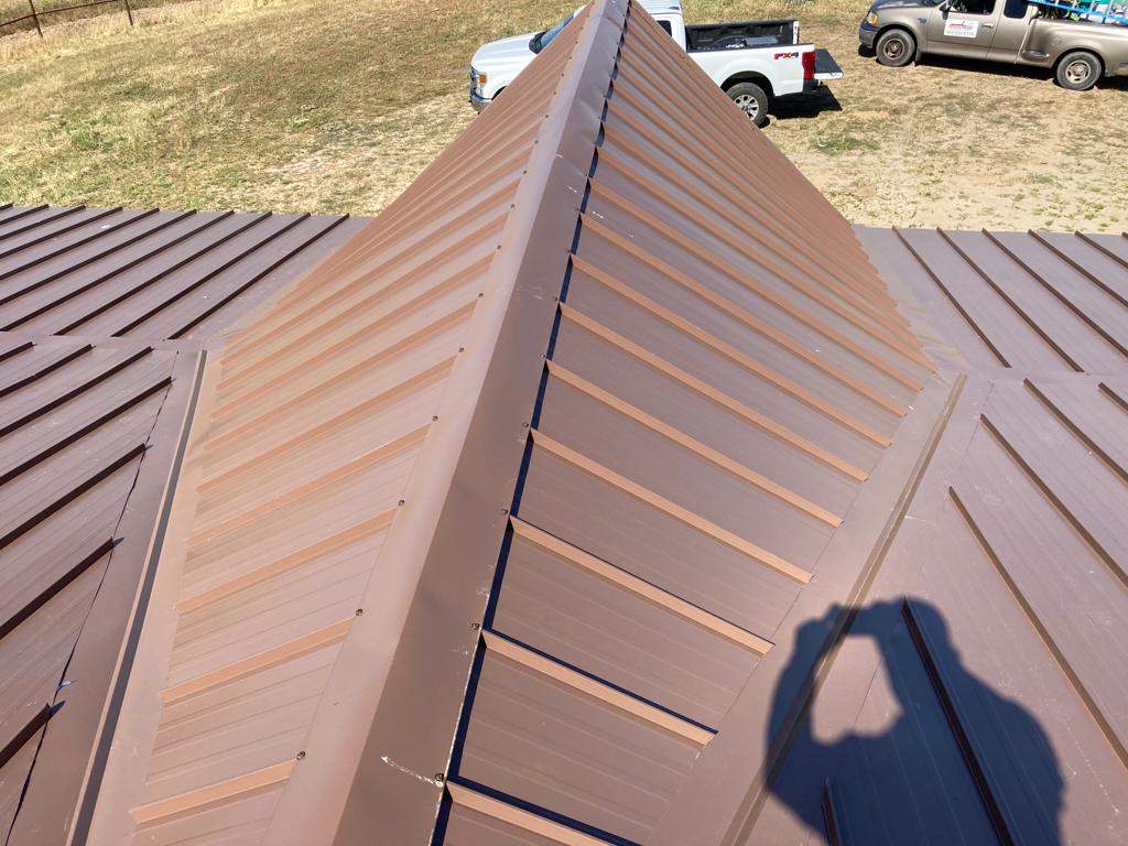 Metal roofing installation using Standing seam metal roofing system by Straight Edge Roofing Inc