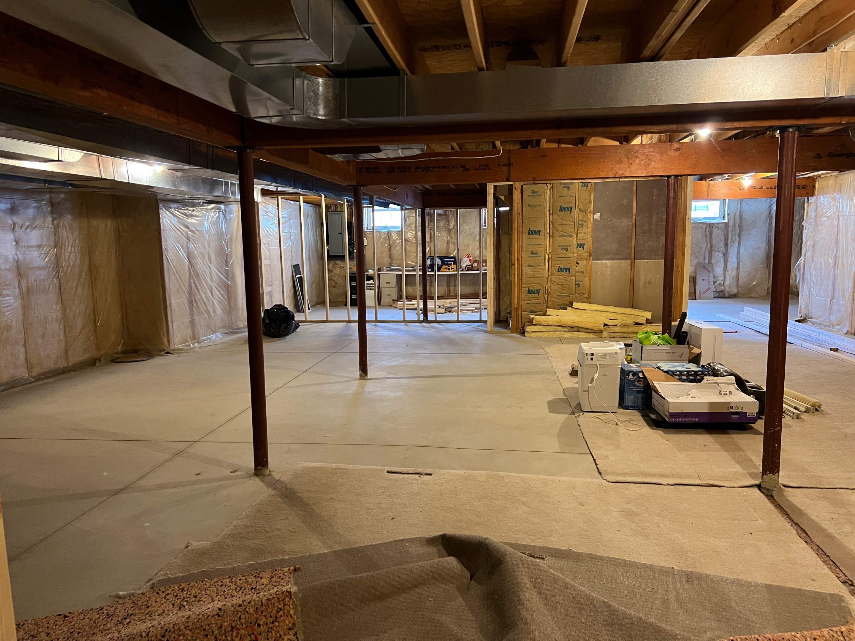 Basement Remodel w/ LVP Flooring & Exposed Ceiling by Chagnon Building & Remodeling LLC