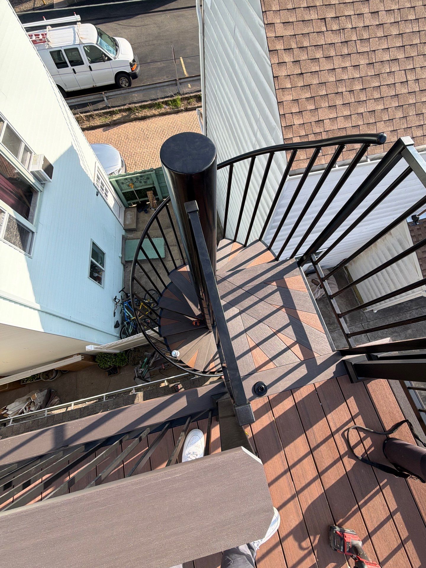 Larry Dietrich Spiral stair and deck by Cousins Roofing Siding & Decks