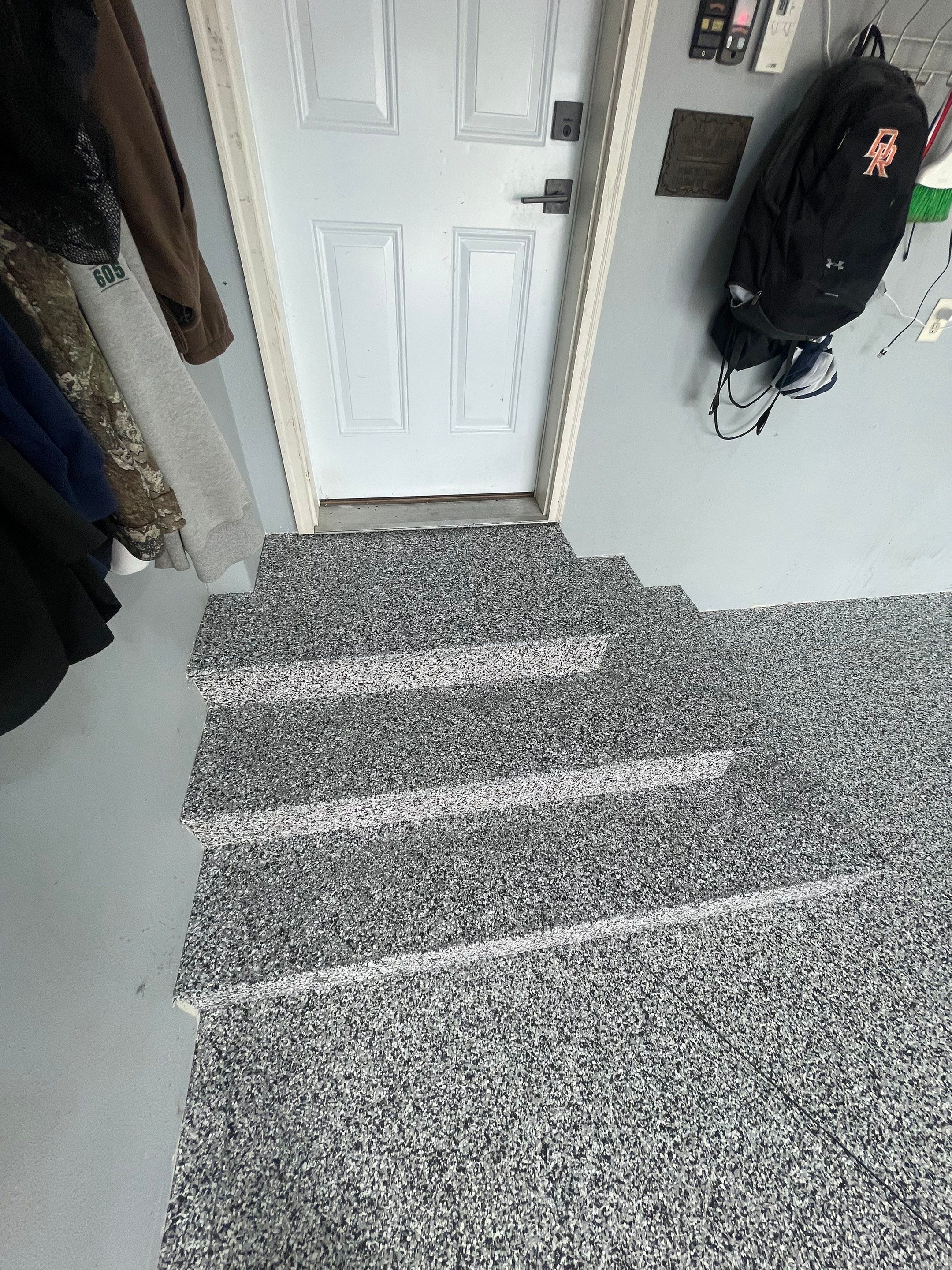 Full Garage Floor Epoxy Coating Installation in Dell Rapids by Select Painting, Coatings & Garage Cabinets