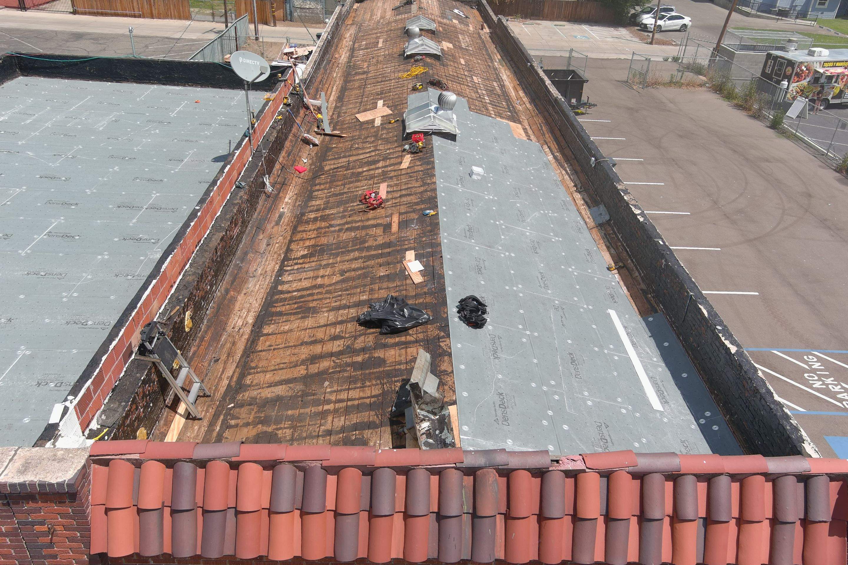 Commercial Roofing Installation using Conklin BenchPly system with PUMA top coat (imbedded fabric system) by Straight Edge Roofing Inc