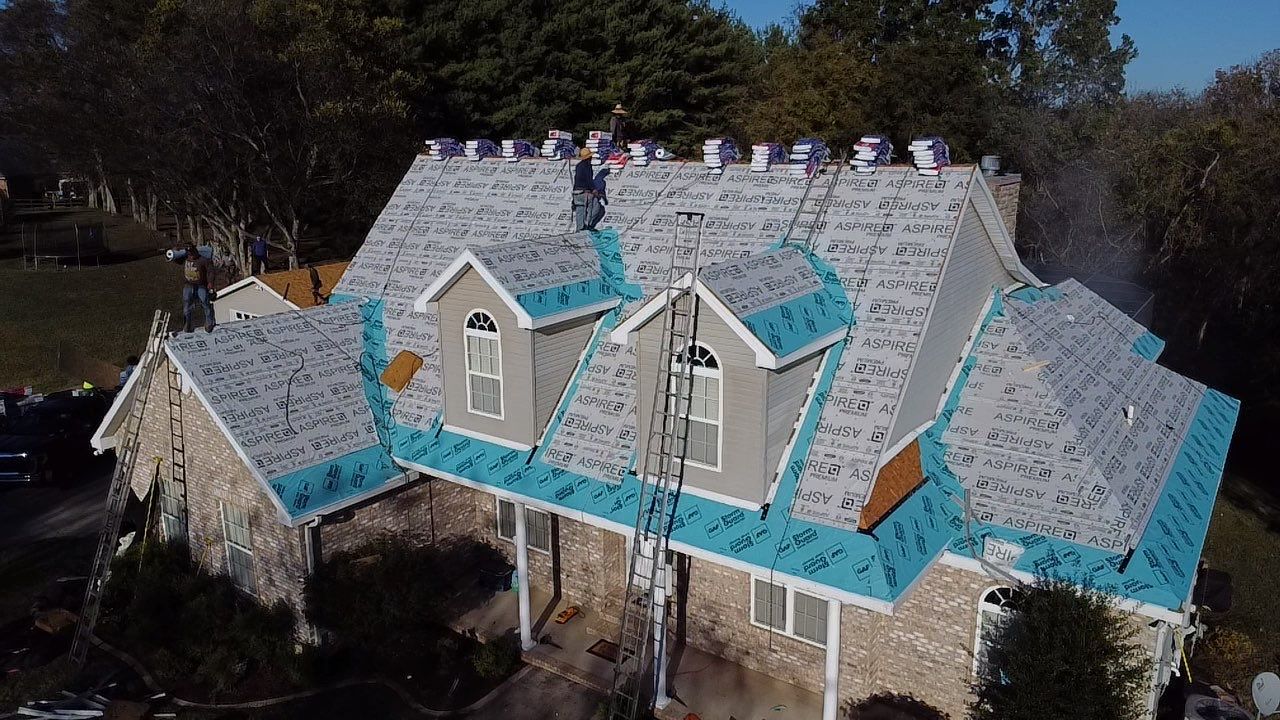 Roof and Gutter System Replacement with Stone Chimney Rebuild by Undersun Roofing 