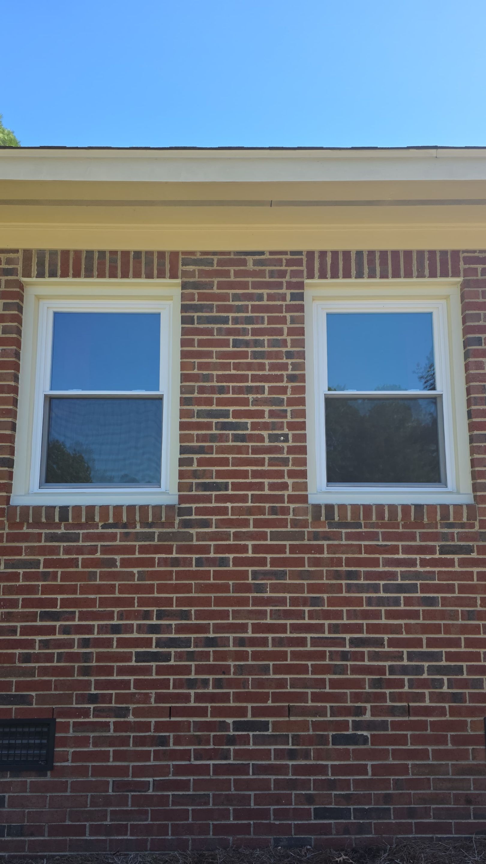 Full Residential Window Replacement for Zebulon Brick Home by The Remodeling Company