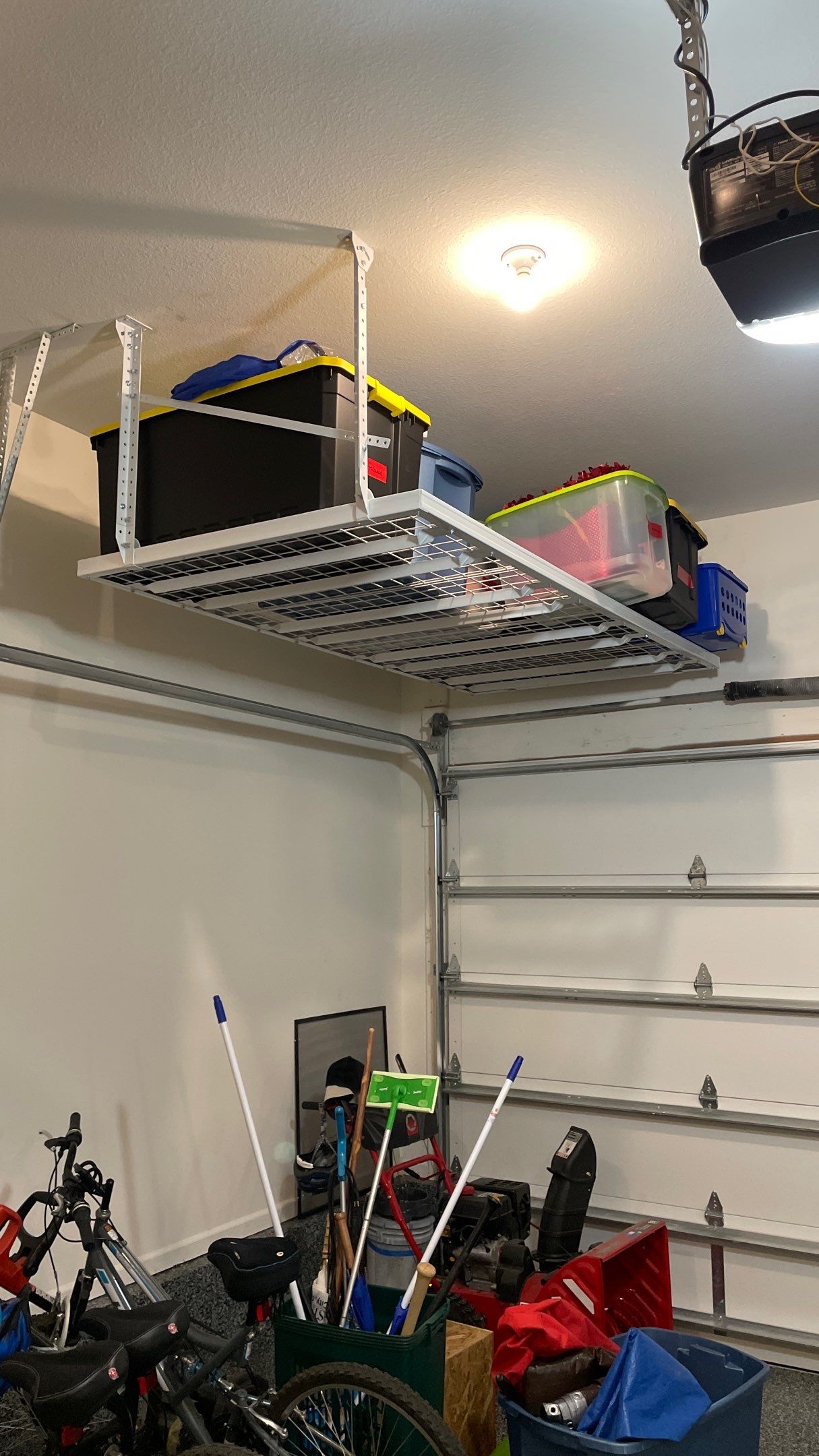 Stacy T. adds ceiling racks to garage for extra storage!  by Banner Garage