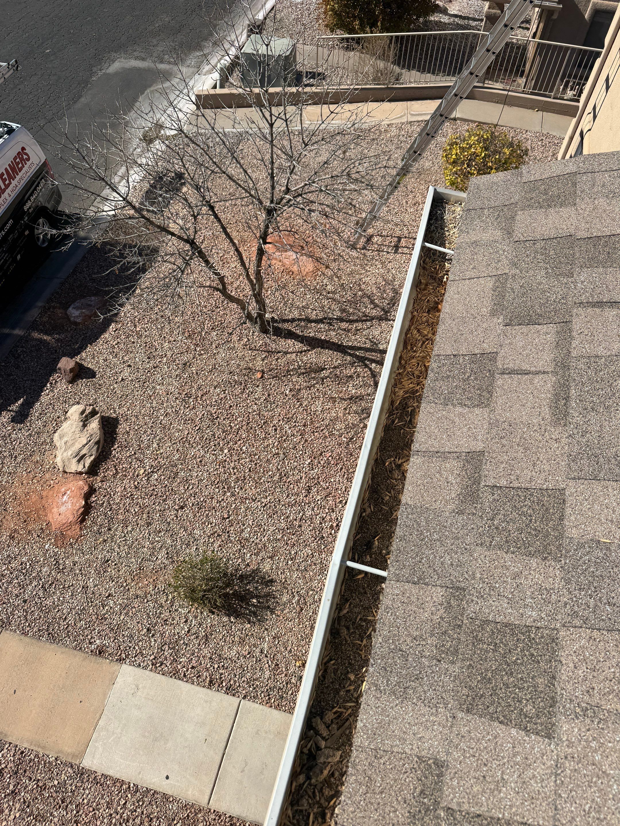 Commercial gutter cleaning Henderson, NV before photo with filled gutters