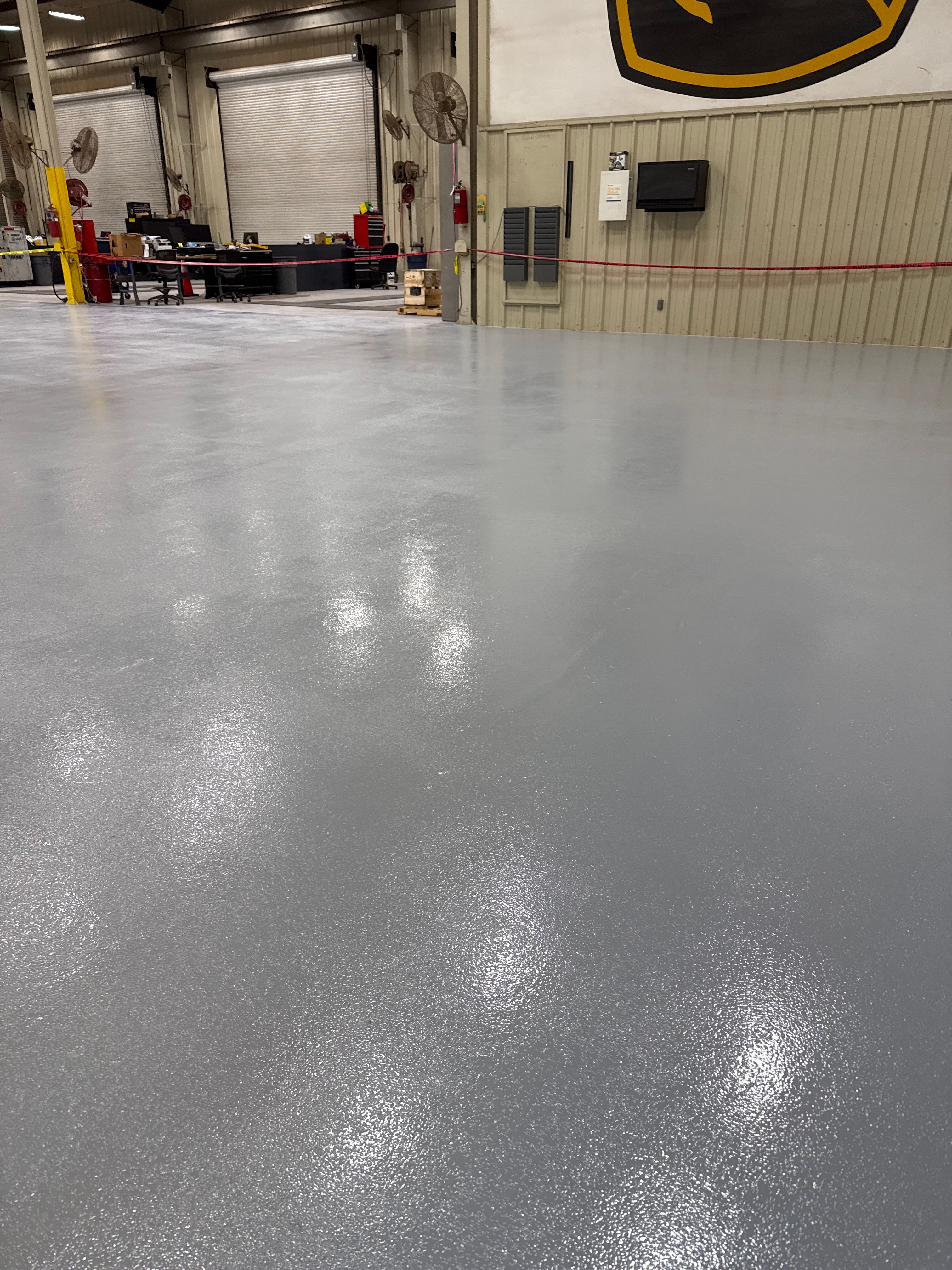 Industrial Epoxy Flooring for Heavy Equipment Work Bay in Mobile by Cornerstone Hard Surface Restoration