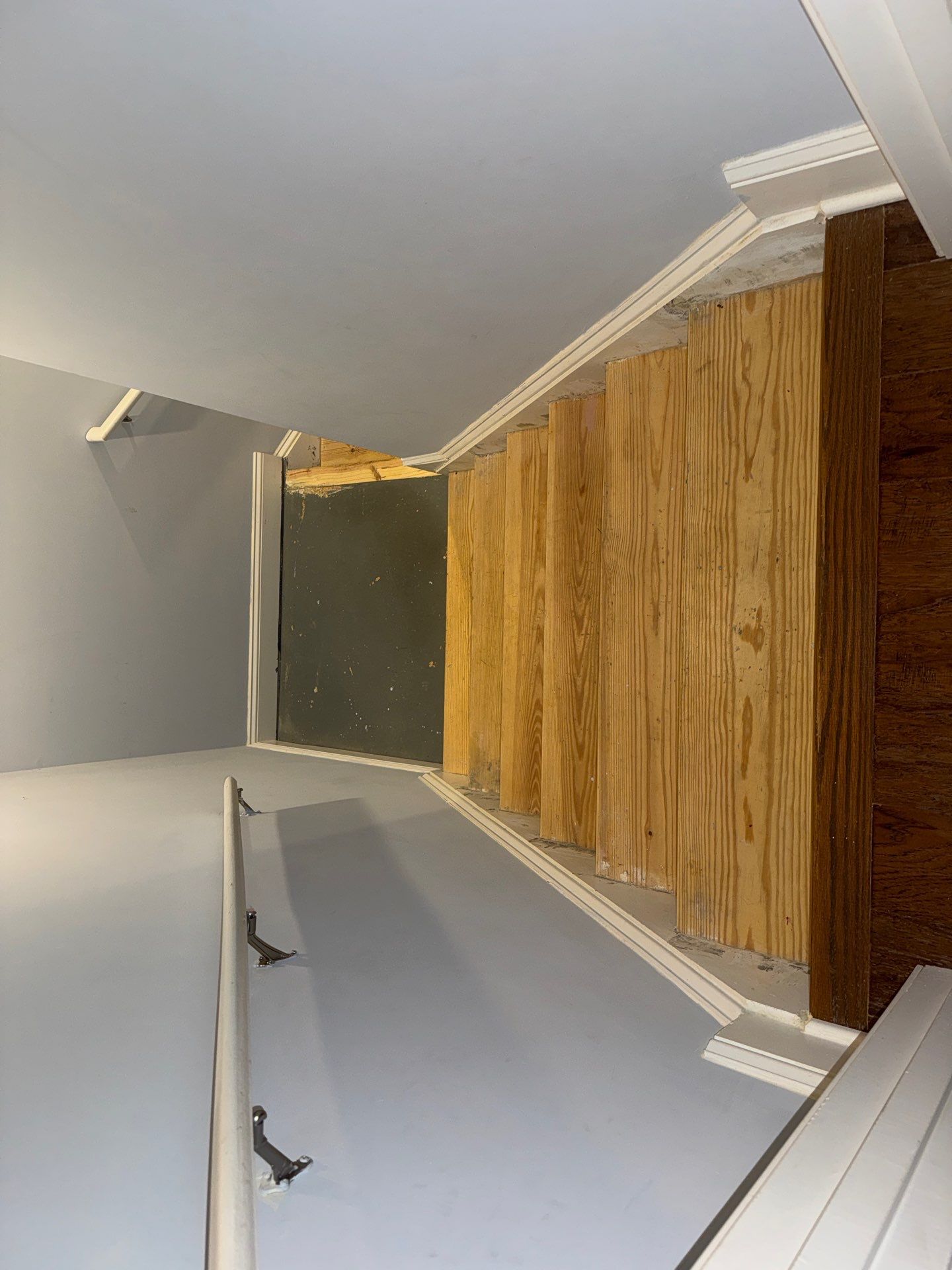Stairway Installation using t vinyl stair tread and reversibleriser by La Bendicion Contruction Llc
