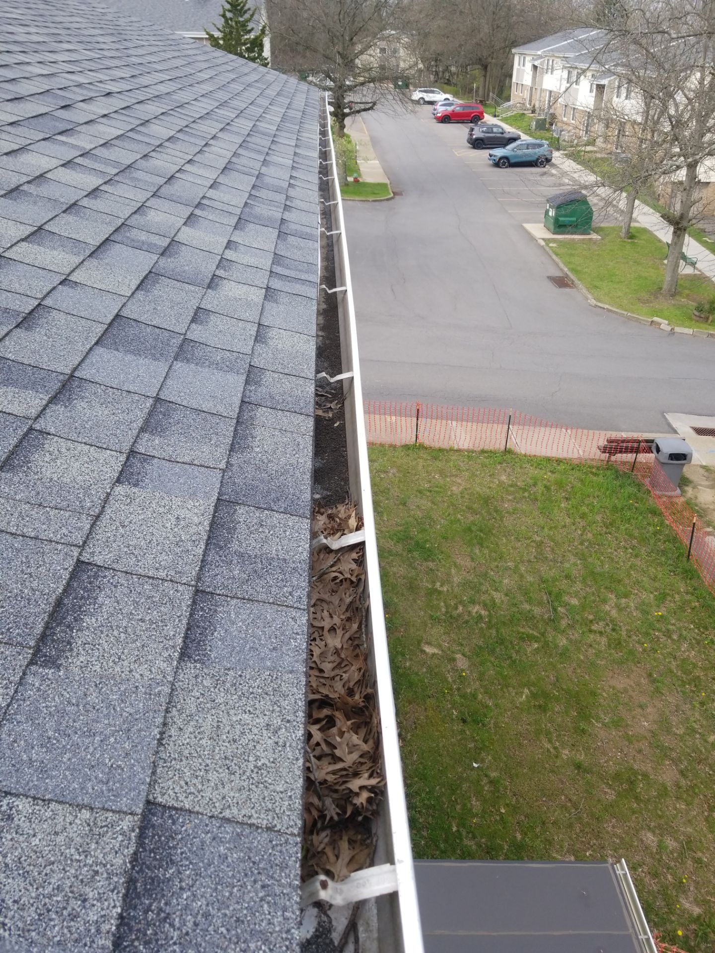 Commercial gutter cleaning Erie, PA before photo with filled gutters