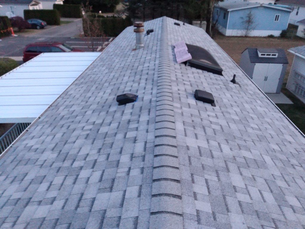 Residential Roofing Installation using OC Oakridge shingles by Top Notch Roofing Inc