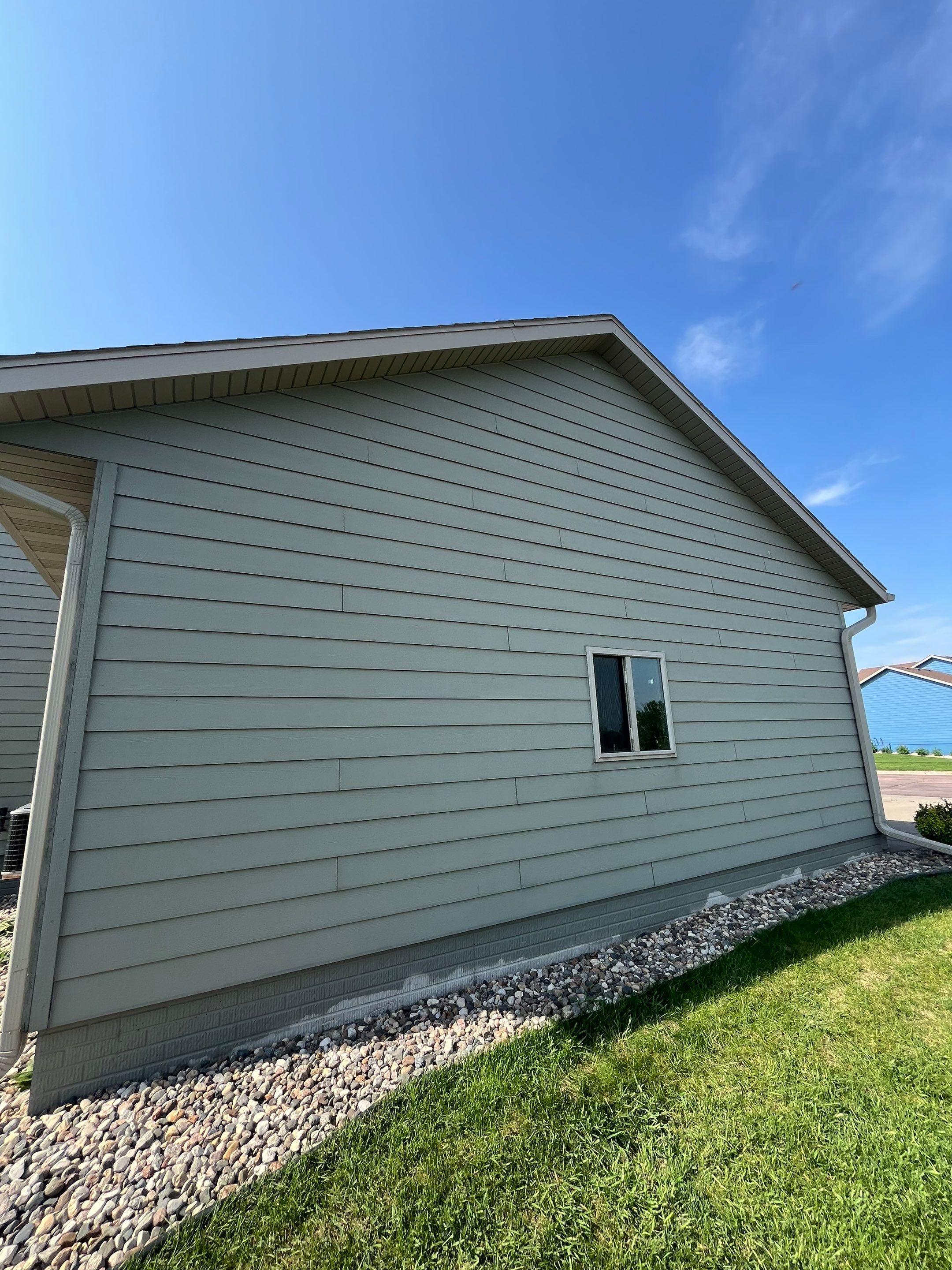 Sioux Falls Residential Exterior Refresh with Fiber Cement Siding by Select Painting, Coatings & Garage Cabinets